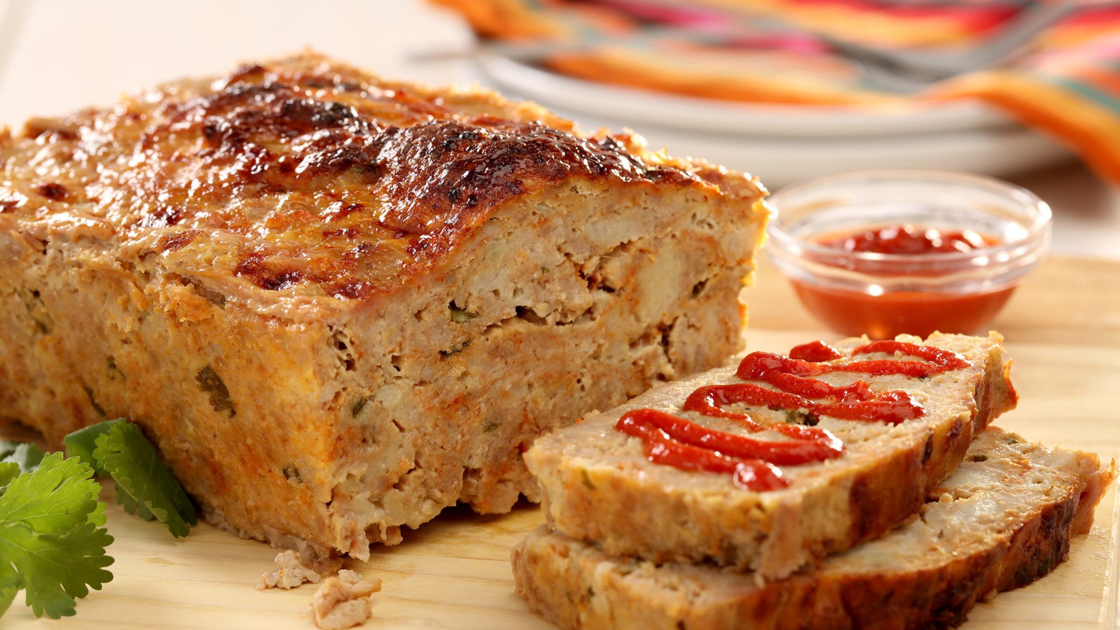 Before slicing, you’ll want to let the baked meatloaf rest in its fat and juices for 10 minutes. Then you’ll have the juiciest meatloaf ever. (Michael Tercha/Chicago Tribune/TNS)