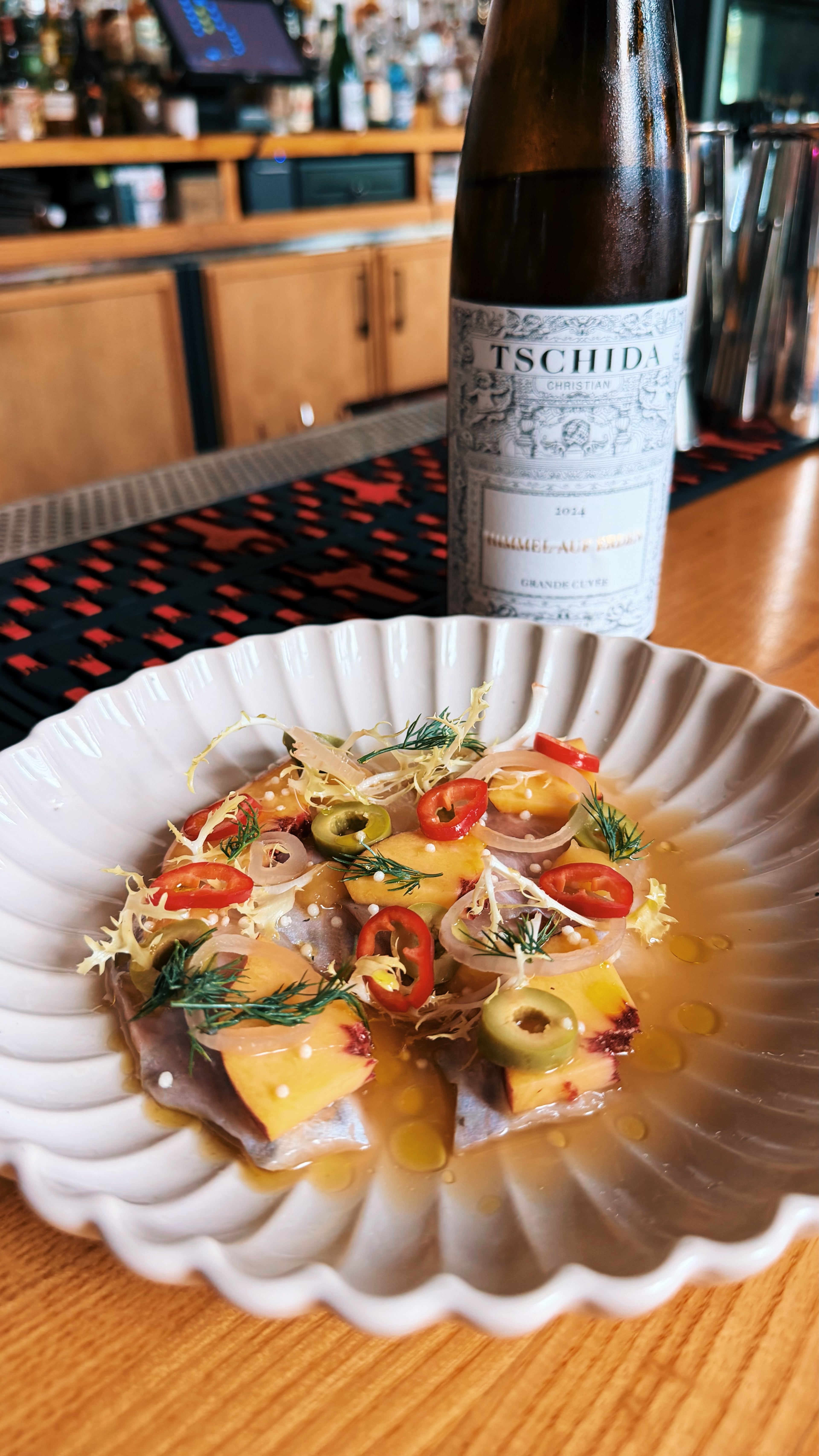 Under Pressure Wine’s North Georgia trout crudo with Christian Tschida Gruner Veltliner. (Courtesy of Adam Berlin)