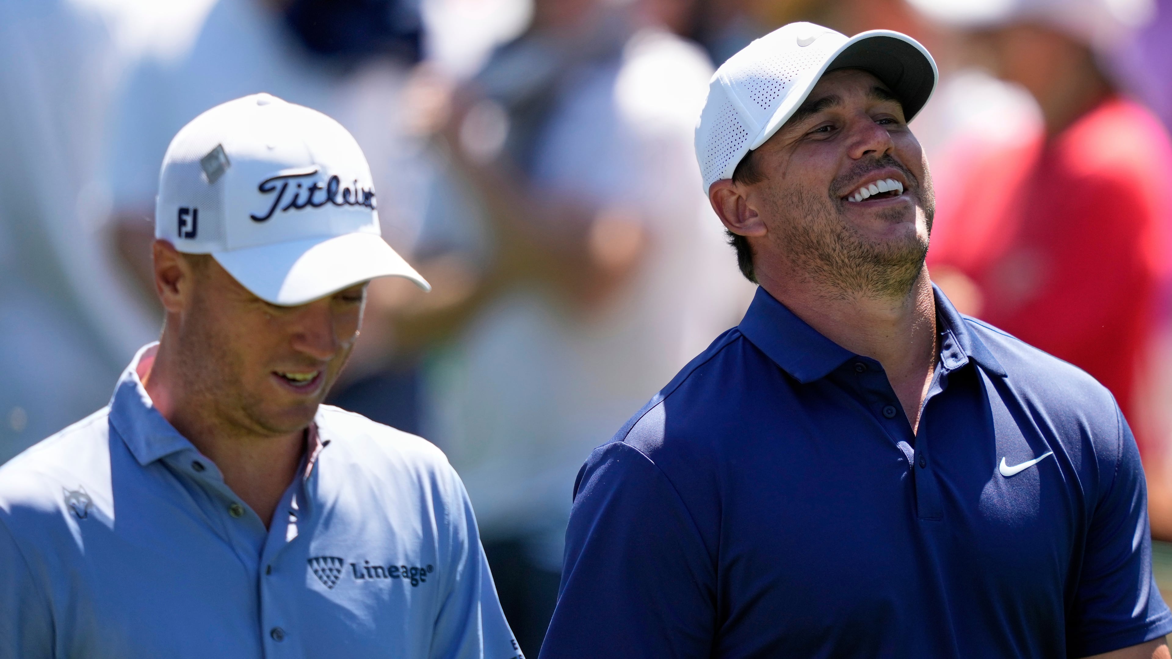 FILE - Brooks Koepka laughs while talking with Justin Thomas, left, on the 15th fairway during a practice round at the Masters golf tournament, Tuesday, April 8, 2025, in Augusta, Ga. (AP Photo/Matt Slocum, File)