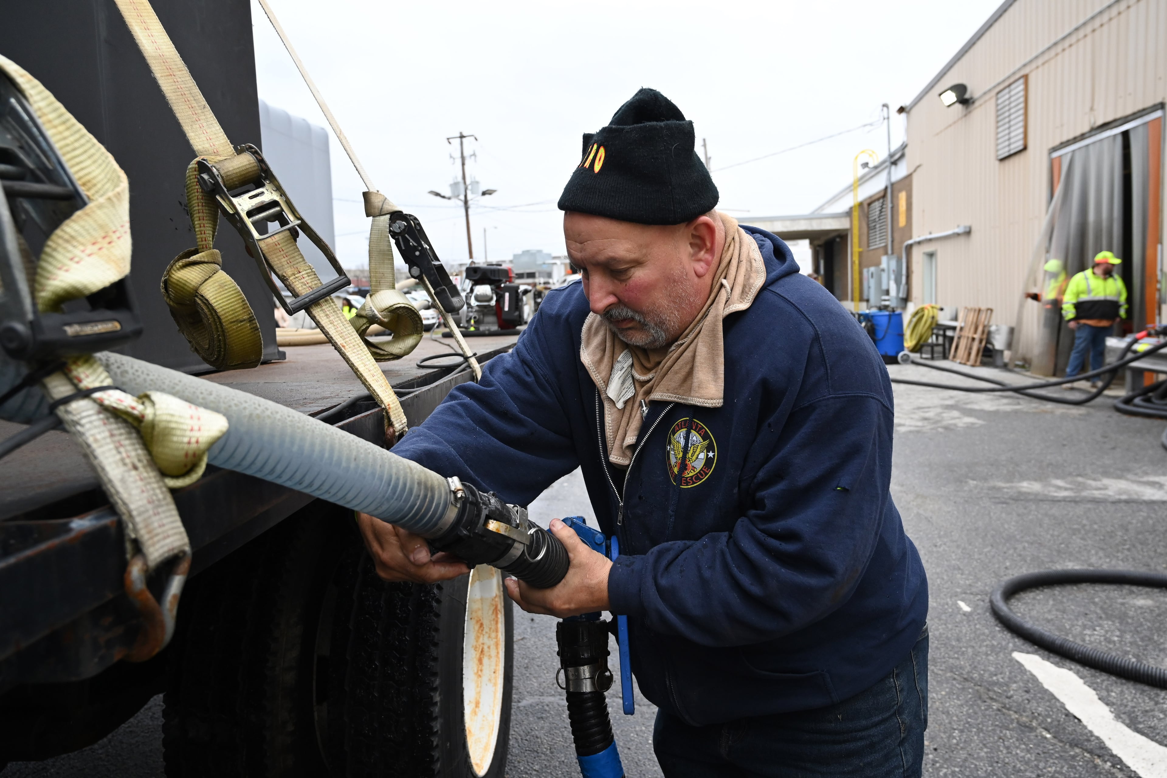 Georgia Department of Transportation worker Nick McKee fills up a tank with brine at Georgia DOT’s Forest Park Maintenance Facility, Friday, Jan. 23, 2026, in Forest Park. (Hyosub Shin/AJC)
