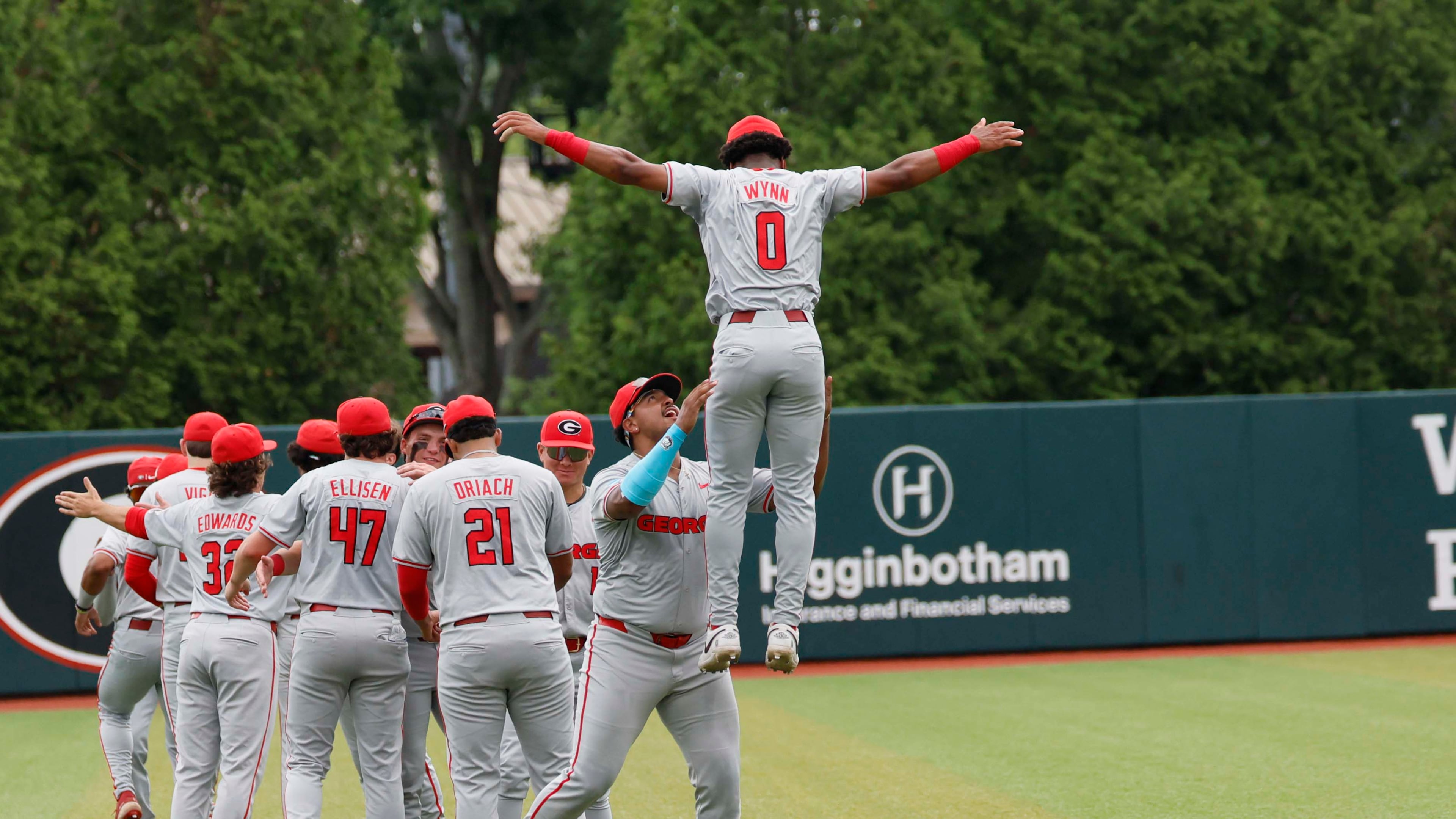 Georgia Bulldog players gather in the outfiled moments before they face the Mississippi State Bulldogs for Game 2 of the NCAA Super Regional at Foley Field on Sunday, June 7, 2026, in Athens. (Miguel Martinez/AJC)