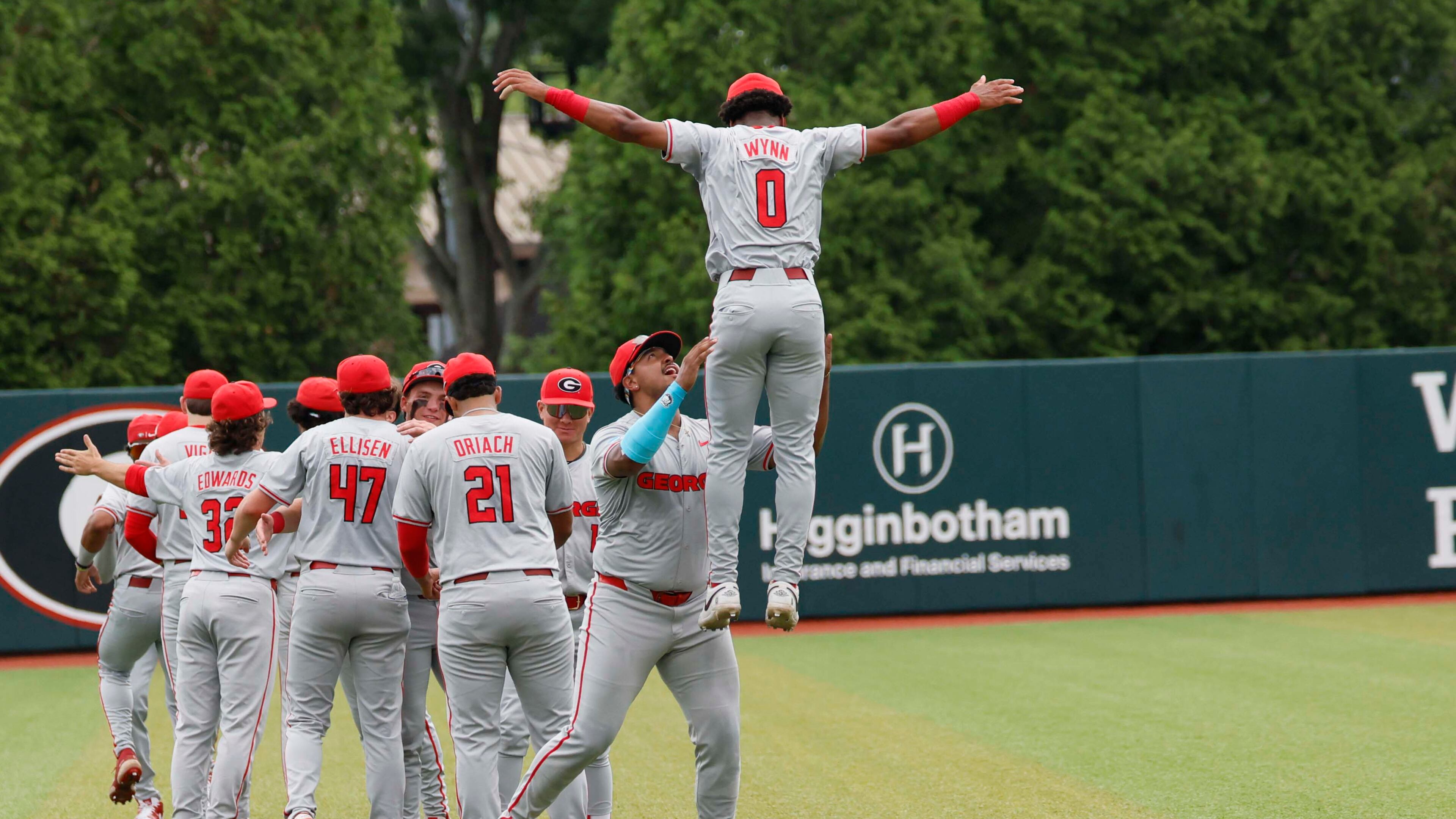 Georgia Bulldog players gather in the outfield moments before they face the Mississippi State Bulldogs for Game 2 of the NCAA Super Regional at Foley Field on Sunday, June 7, 2026, in Athens. (Miguel Martinez/AJC)