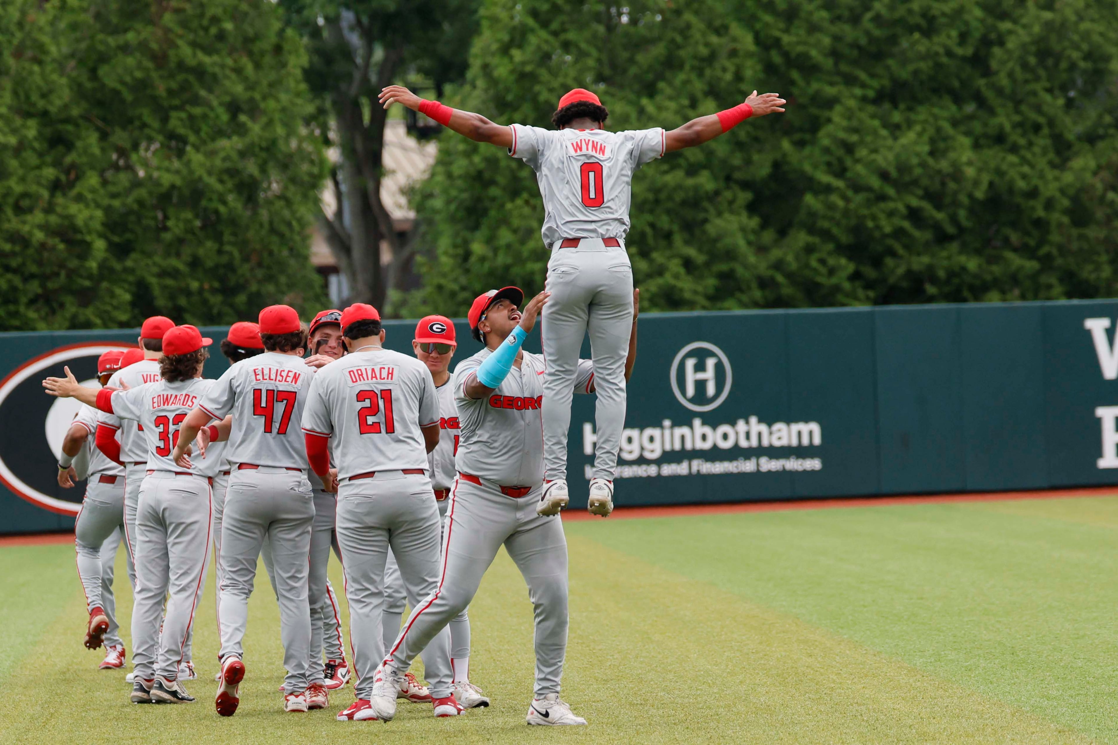 Georgia Bulldog players gather in the outfiled moments before they face the Mississippi State Bulldogs for Game 2 of the NCAA Super Regional at Foley Field on Sunday, June 7, 2026, in Athens. Miguel Martinez/AJC)