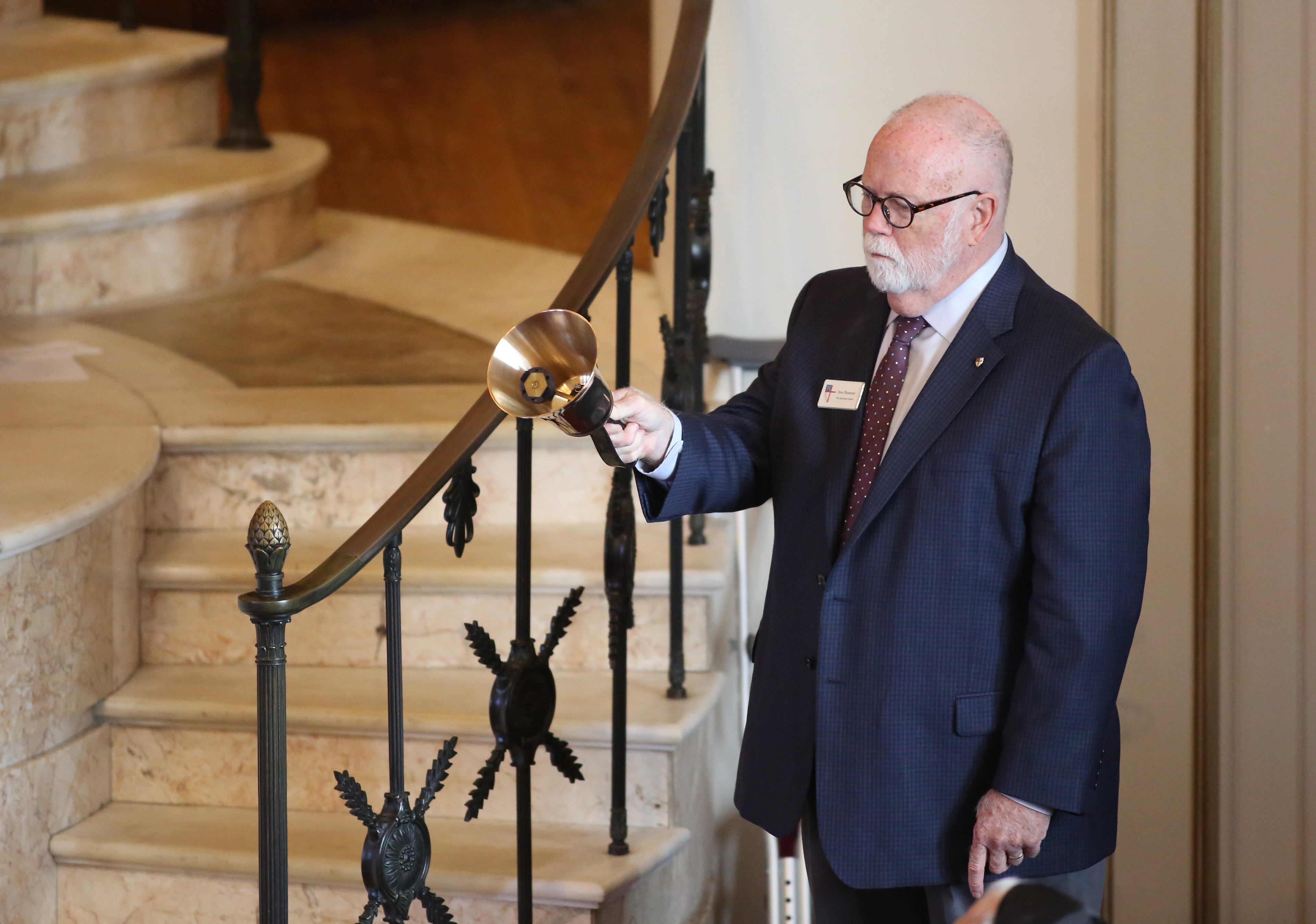 October 30, 2018 - Atlanta, Ga: A man rings a bell after the name of one of the eleven Pittsburgh synagogue shooting victims is read during a prayer vigil for the shooting at The Temple Tuesday, October 30, 2018, in Atlanta. The Temple hosted an interfaith prayer vigil in conjunction with Outcry. The event was in honor of the eleven people killed at a Pittsburgh synagogue Saturday Oct. 27th. (JASON GETZ/SPECIAL TO THE AJC)