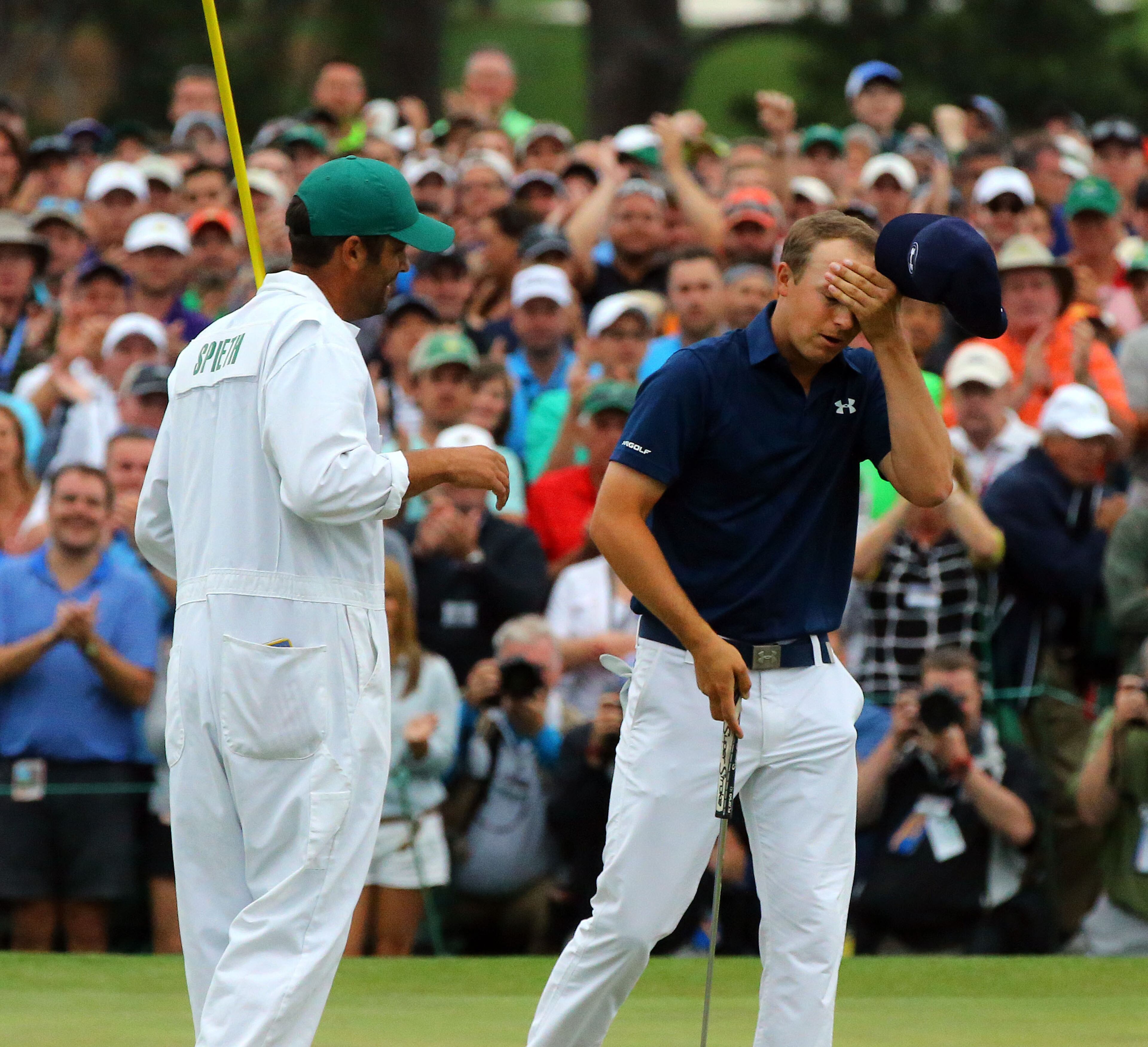 Jordan Spieth reacts on the 18th green as he wins the 79th Masters Golf Tournament at 270, tying Tiger Woods 1997 win. Photos from the final round at the Masters Golf Tournament, Sunday, April 12, 2015. CURTIS COMPTON/CCOMPTON@AJC.COM