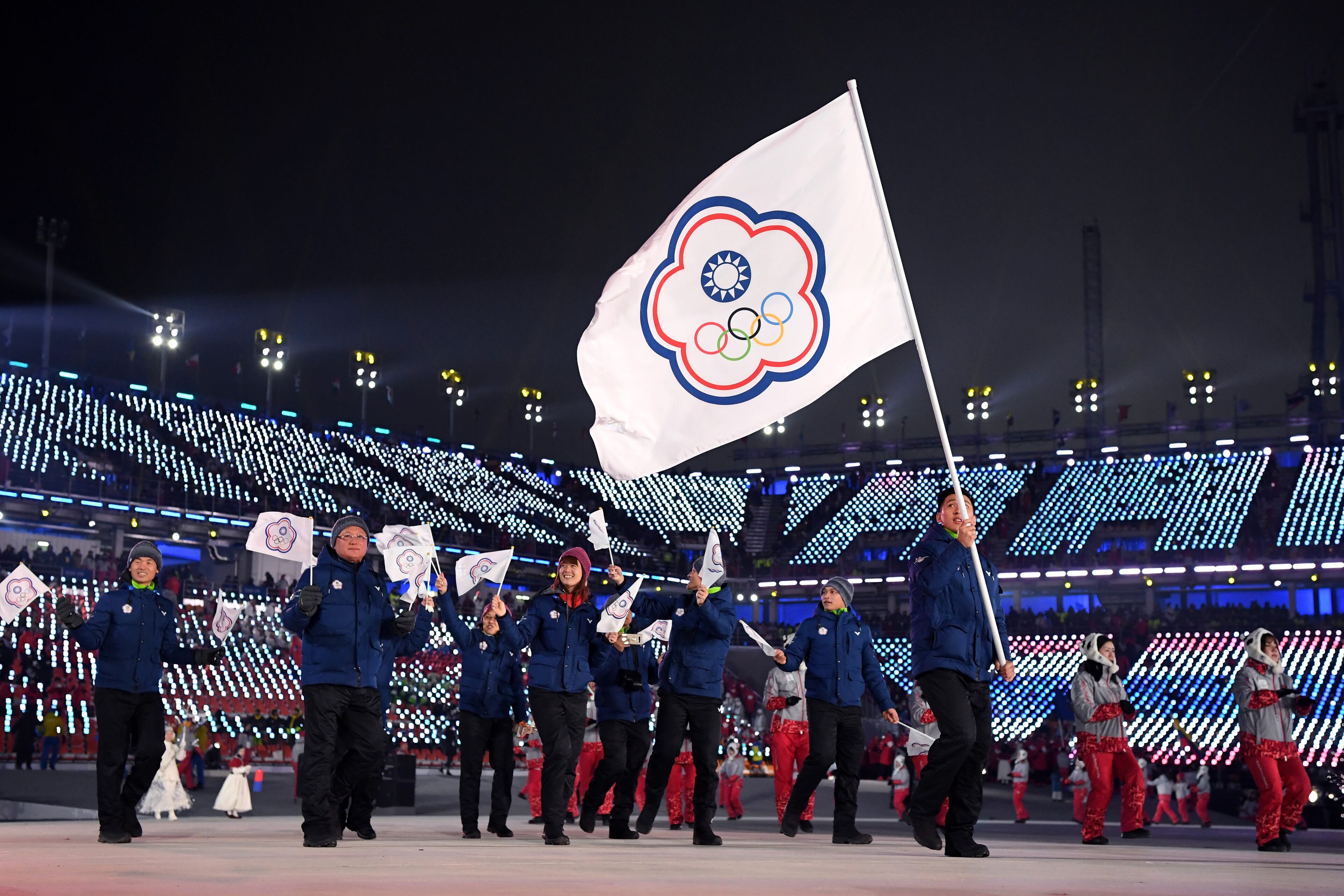 PYEONGCHANG-GUN, SOUTH KOREA - FEBRUARY 09: Flag bearer Te-An Lien of Chinese Taipei and teammates enter the stadium during the Opening Ceremony of the PyeongChang 2018 Winter Olympic Games at PyeongChang Olympic Stadium on February 9, 2018 in Pyeongchang-gun, South Korea. (Photo by Matthias Hangst/Getty Images)