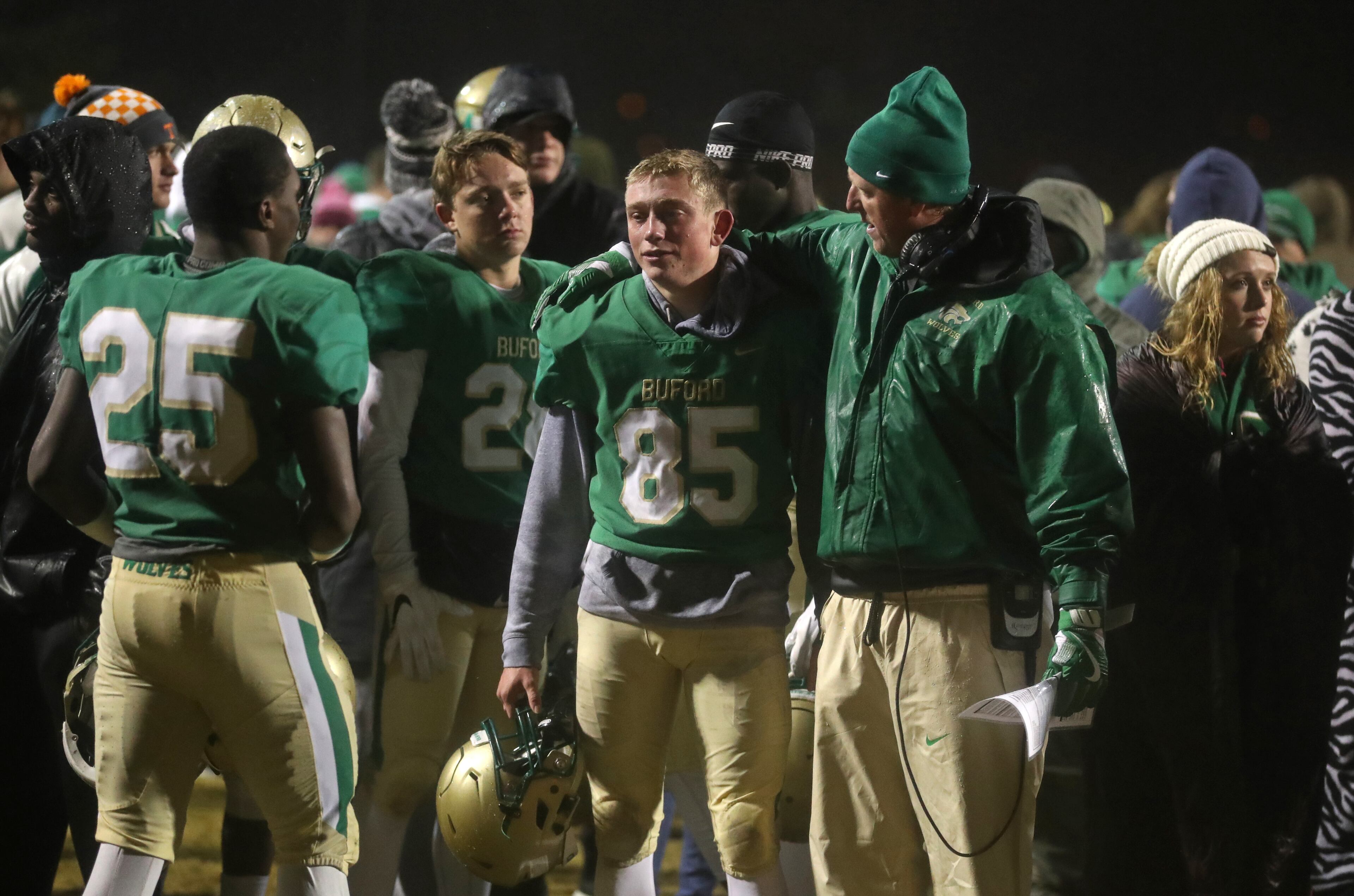 November 23, 2018 - Buford, Ga: Buford coach John Ford, right, consoles kicker Hayden Olsen (85) after their 23-20 loss to Bainbridge at Buford High School Friday, November 23, 2018, in Buford, Ga. This is the quarter finals of the Class 5A state playoffs. (JASON GETZ/SPECIAL TO THE AJC)