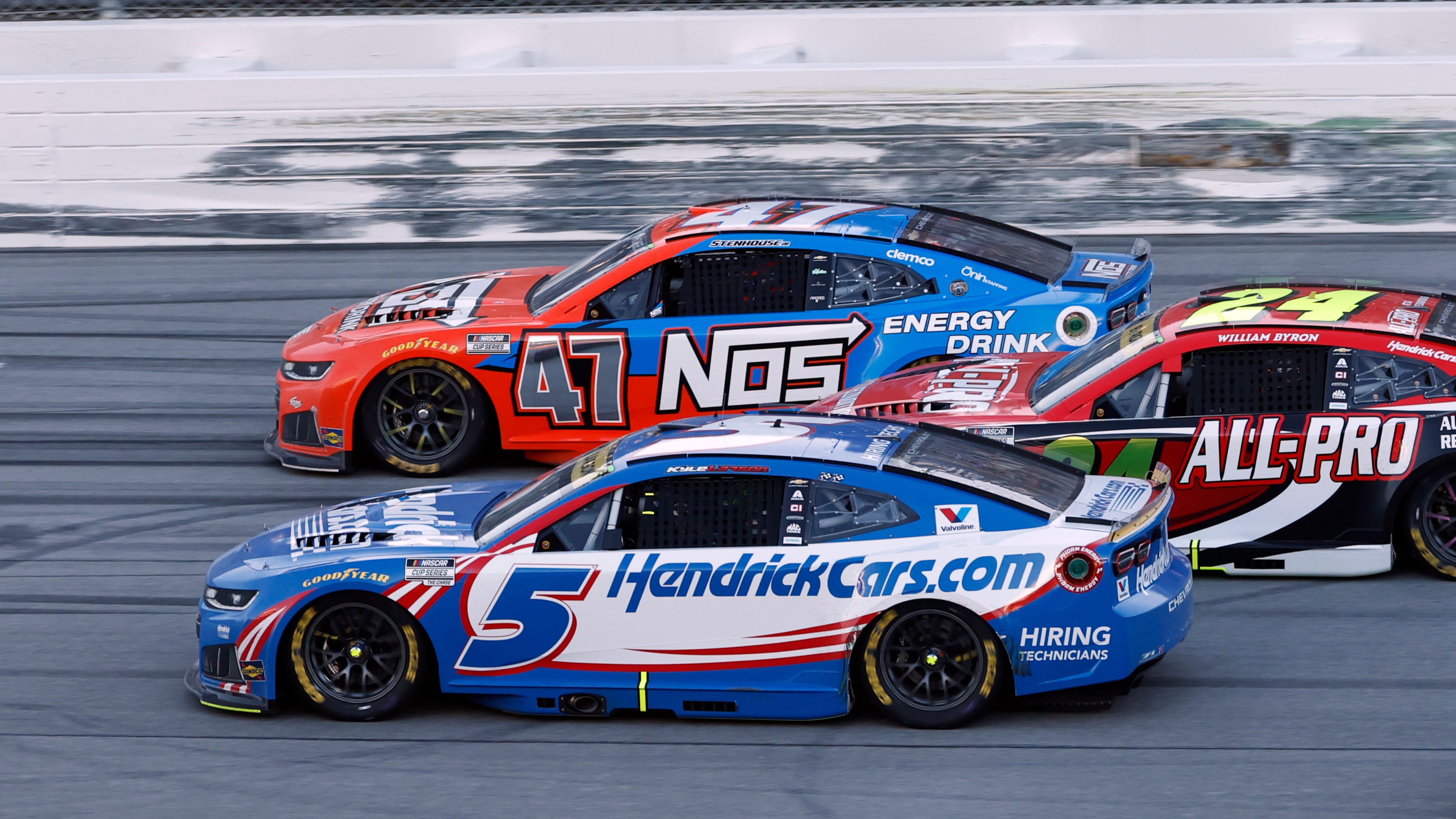 Kyle Larson (5) passes Ricky Stenhouse Jr. (47) for the win in a NASCAR Cup Series auto race, Sunday, Oct. 25, 2026, in Talladega, Ala. (AP Photo/Butch Dill)