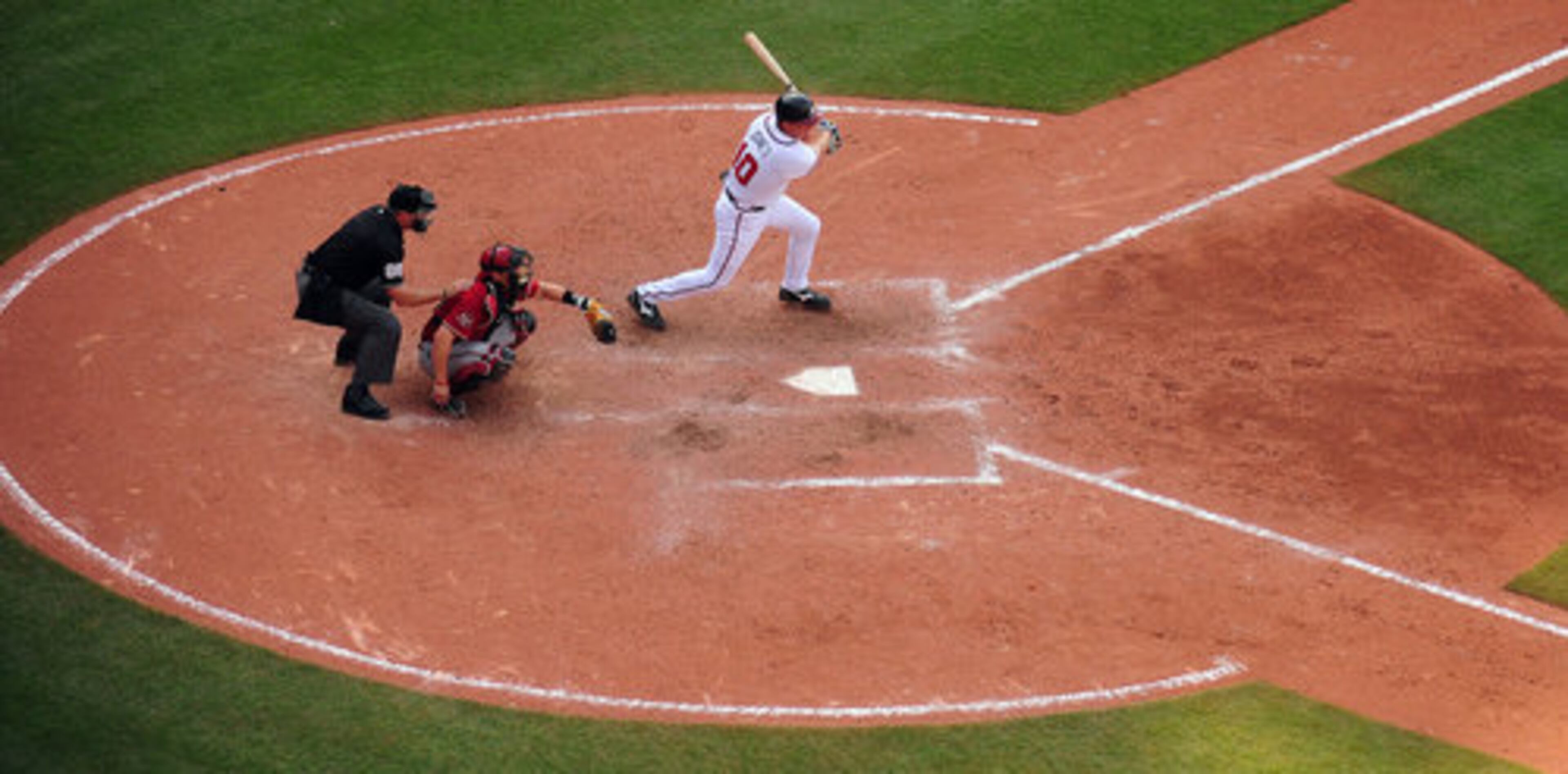Braves third baseman Chipper Jones smacks a single in the bottom of the ninth inning. It was followed shortly by Francoeur's two-run home run.