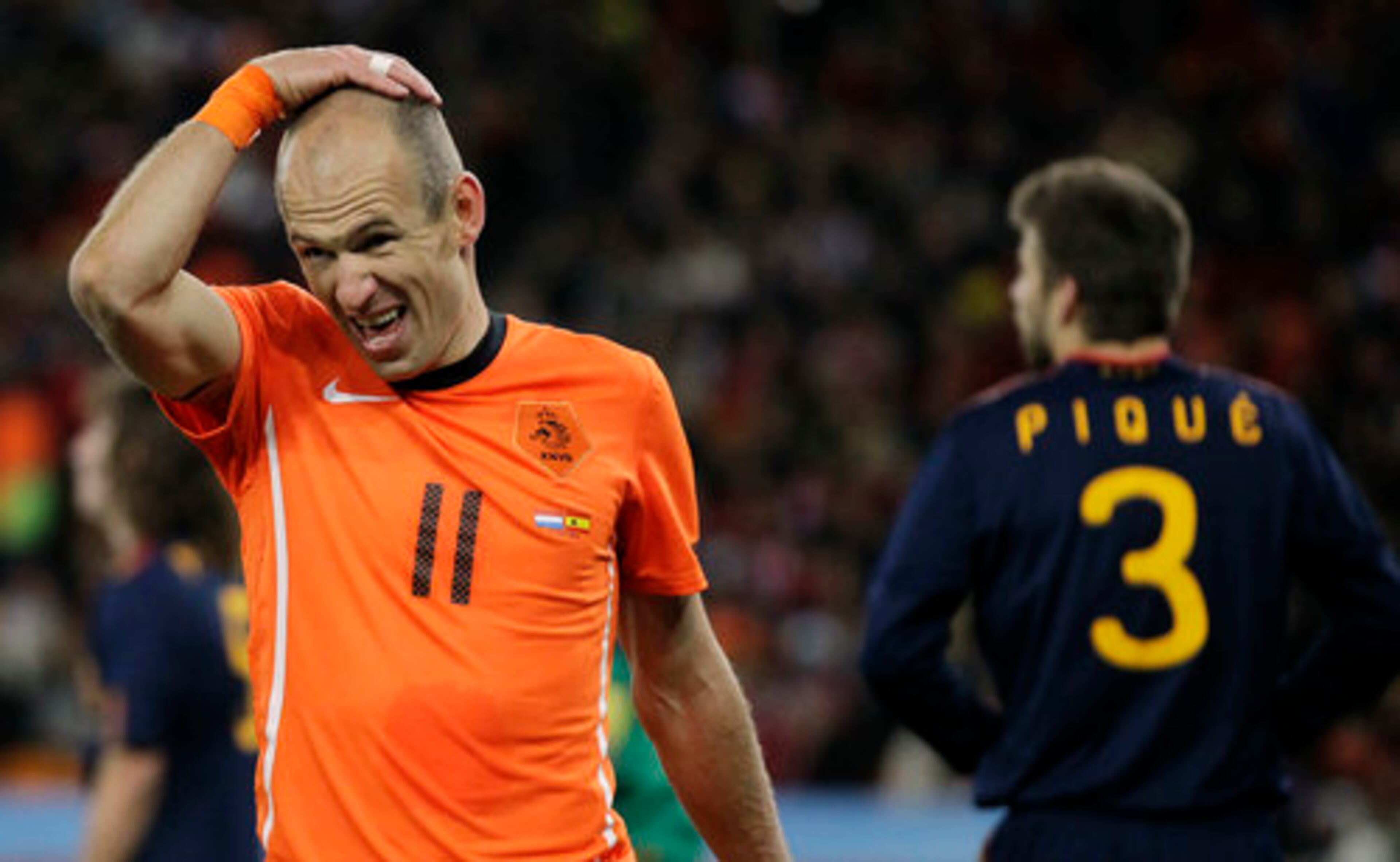 Netherlands' Arjen Robben, left, reacts after a missed scoring chance.