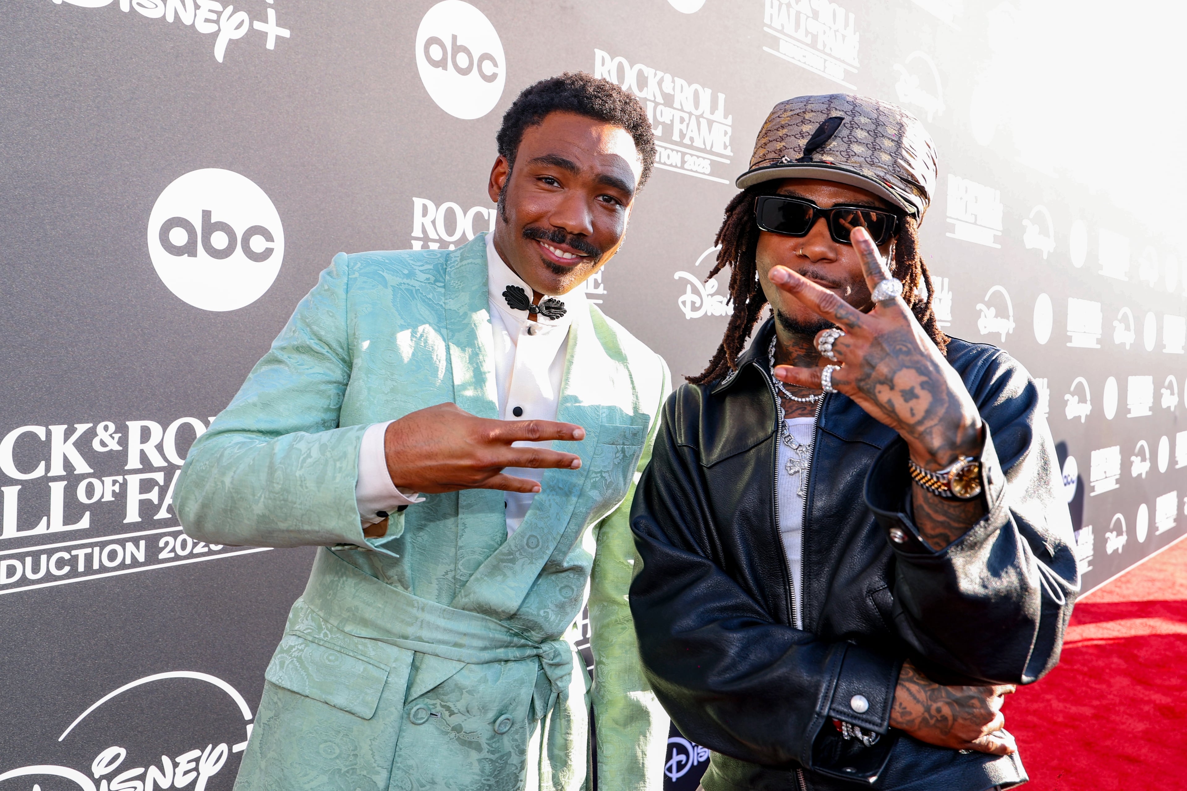 Atlanta natives actor, singer Donald Glover and hip-hop artist J.I.D attend the 2025 Rock & Roll Hall of Fame Induction Ceremony at Peacock Theater on November 08, 2025 in Los Angeles, California. (Photo by Kevin Mazur/Kevin Mazur/Getty Images for RRHOF)