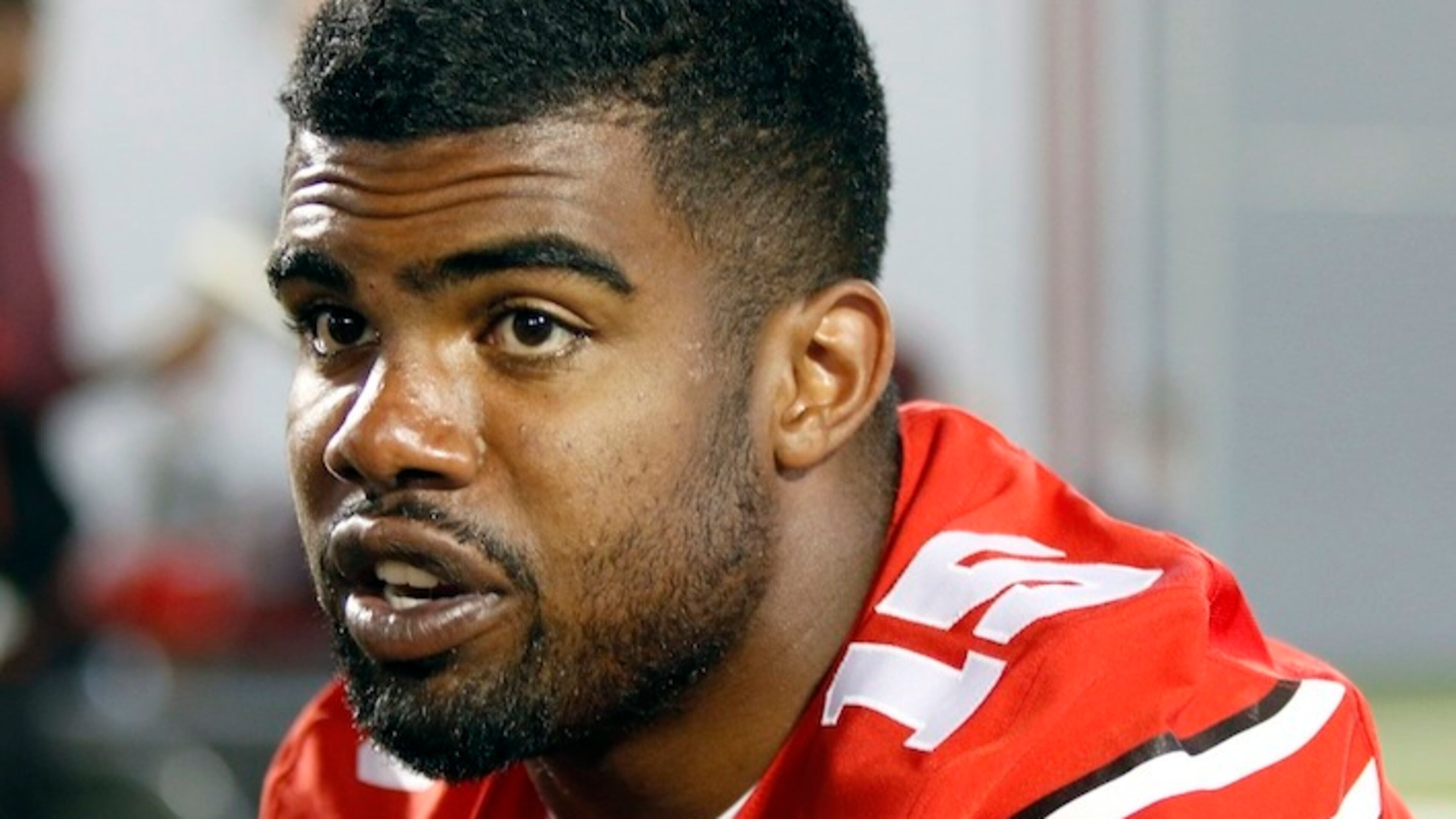 In this Aug. 16, 2015, file photo, Ohio State running back Ezekiel Elliott speaks to reporters during the university's NCAA college football media day in Columbus, Ohio. Elliott apologized for the critical comments he made about play calling after the Michigan State game and says it was the wrong time to make it known he would not be returning to school next season. Elliott posted a long apology on Twitter on Monday, Nov. 23, 2015, saying, "My intentions were not to point fingers at anyone for OUR failures." (AP Photo/Paul Vernon, File)