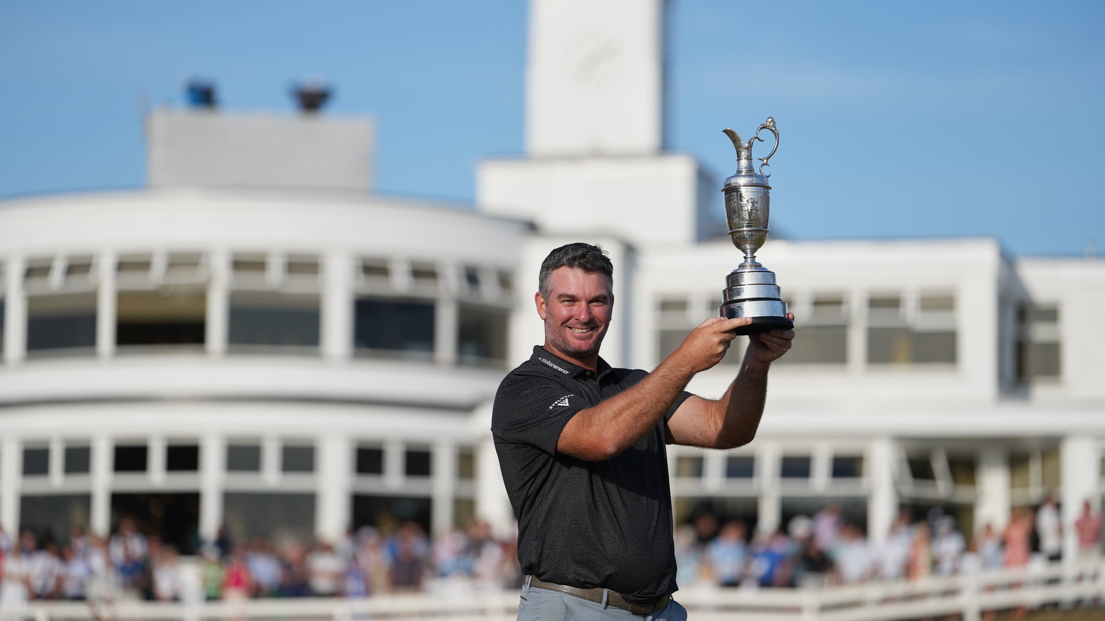 Ryan Fox of New Zealand poses with the Claret Jug trophy in front of the club house, after winning the British Open Golf championships at Royal Birkdale golf club, in Southport, England, Sunday, July 19, 2026. (AP Photo/Jon Super)