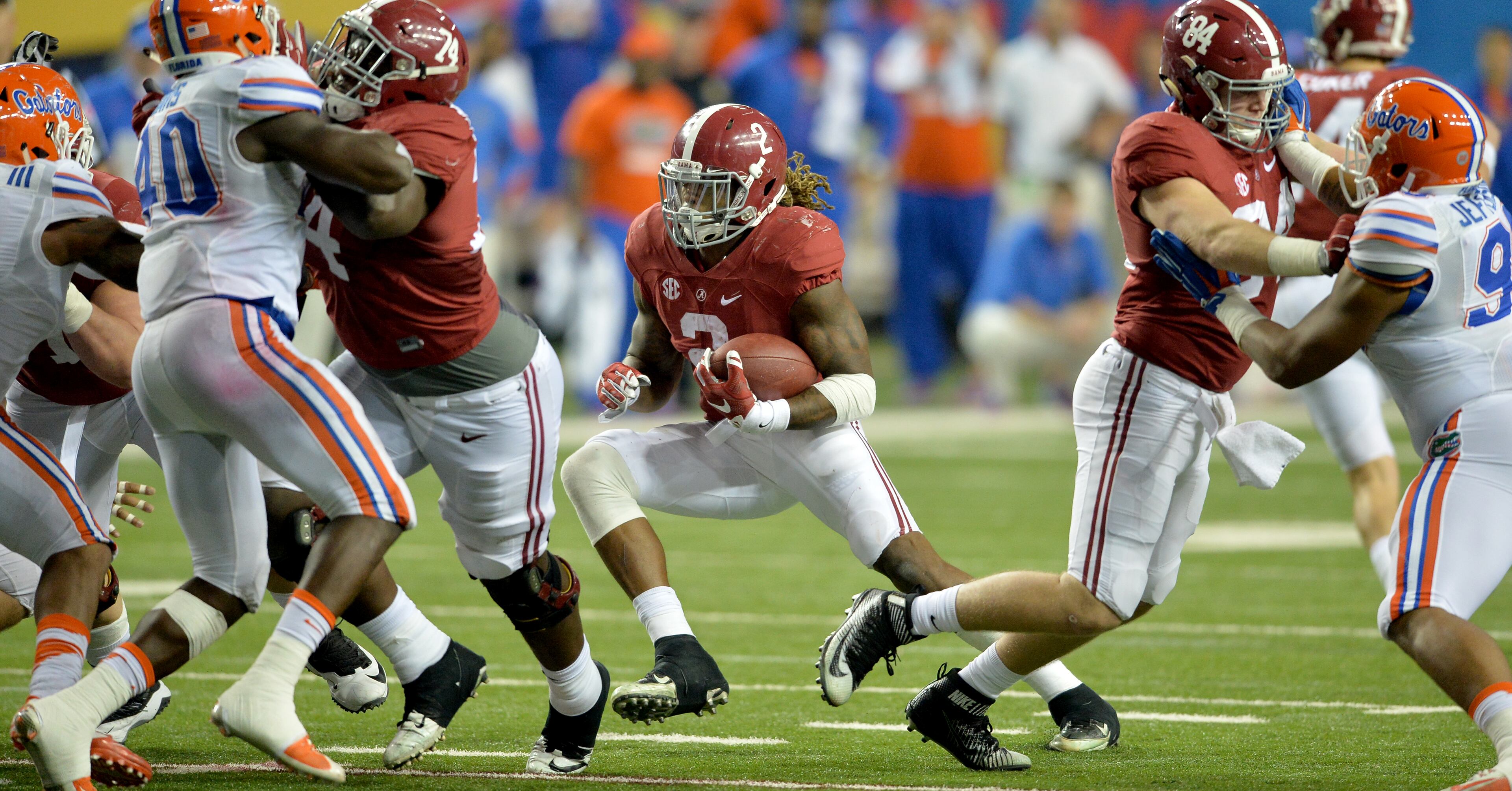 December 5, 2015 Atlanta: Alabama Crimson Tide running back Derrick Henry looks for running room against Florida during the SEC Championship at the Georgia Dome Saturday December 5, 2015. BRANT SANDERLIN/BSANDERLIN@AJC.COM