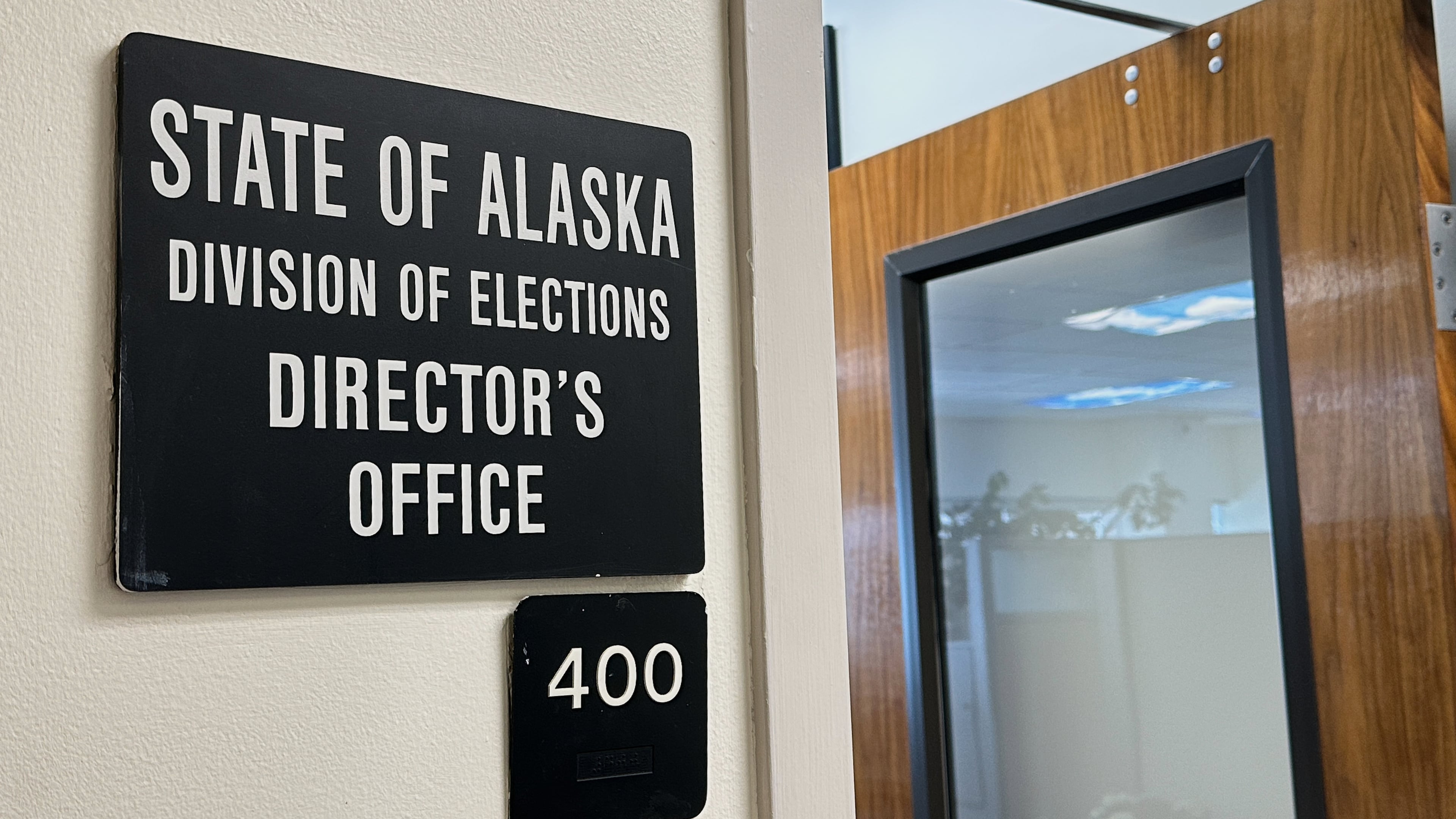 FILE - A sign indicates the director's office of the Alaska Division of Elections, March 19, 2026, in Juneau, Alaska. (AP Photo/Becky Bohrer, File)