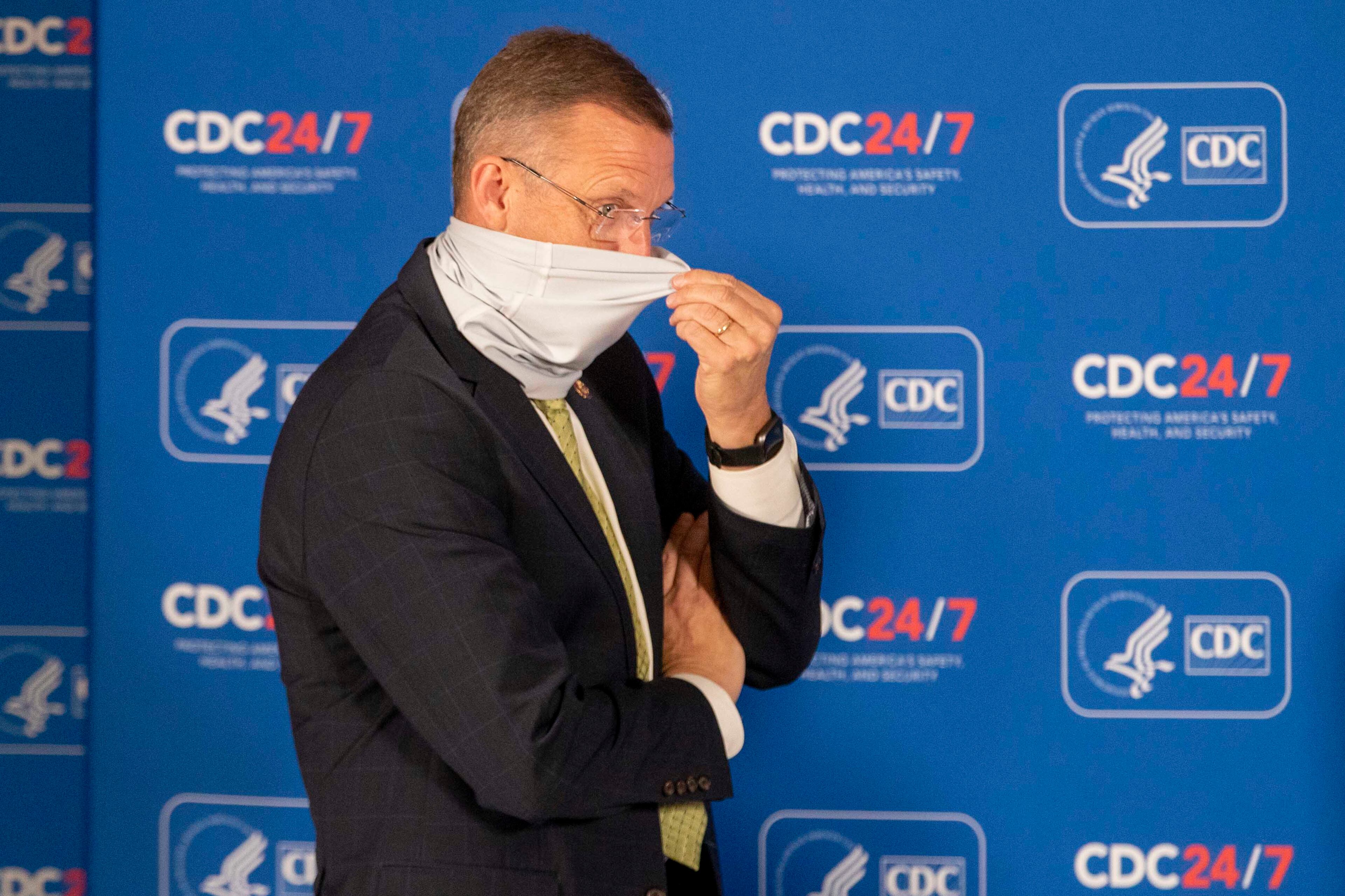 Georgia Congressman Doug Collins adjusts his face mask before the start of a round table discussion with Vice President Mike Pence and Dr. Robert Redfield, Director of the Centers for Disease Control and Prevention, at the Center for Disease Control and Prevention in Atlanta, Friday, Dec. 4, 2020. (Alyssa Pointer/Atlanta Journal-Constitution/TNS)