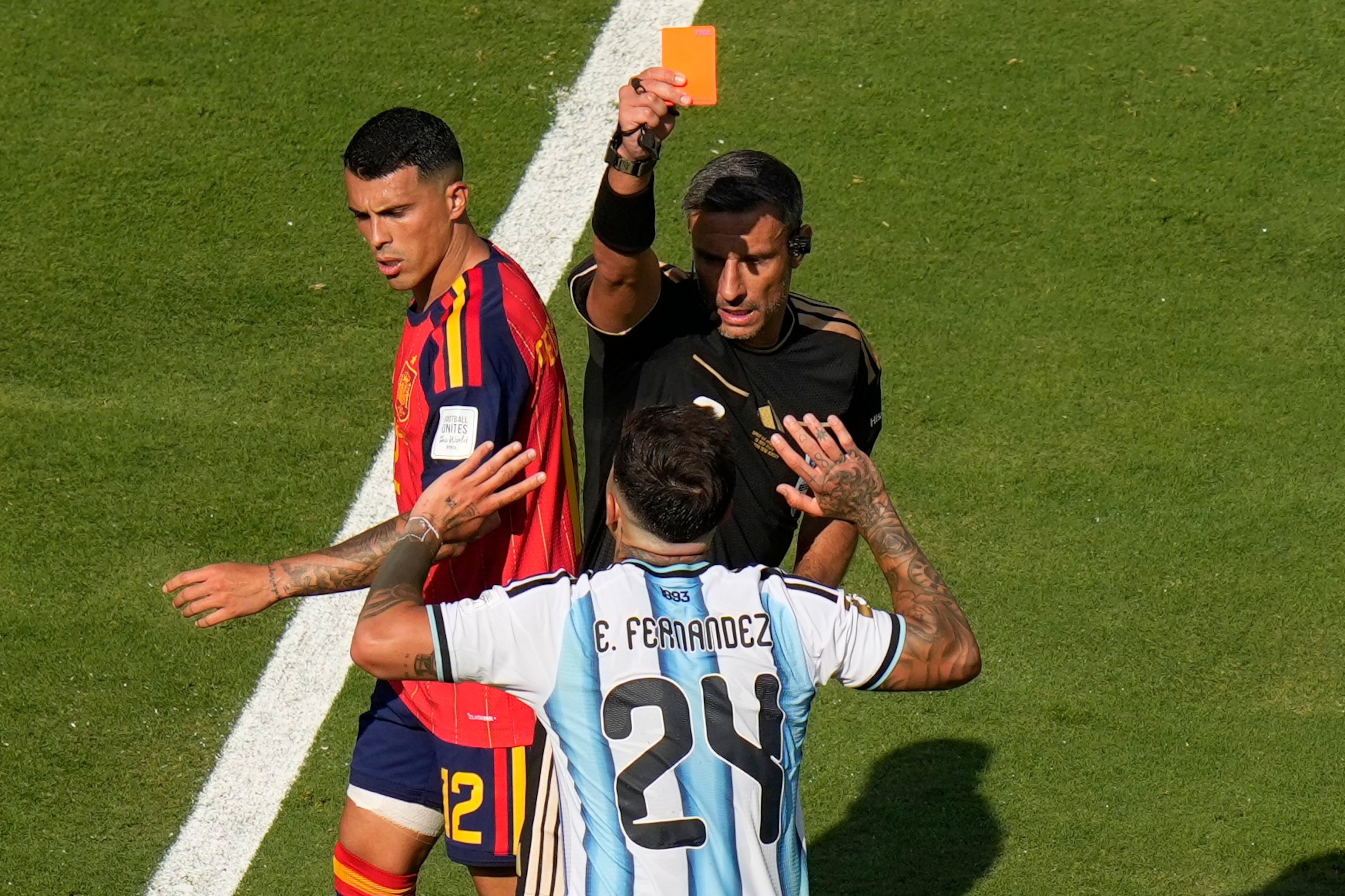 Referee Slavko Vincic of Slovenia shows the red card to Argentina's Enzo Fernandez during the World Cup final soccer match between Spain and Argentina in East Rutherford, N.J., near New York, Sunday, July 19, 2026. (Seth Wenig/AP)