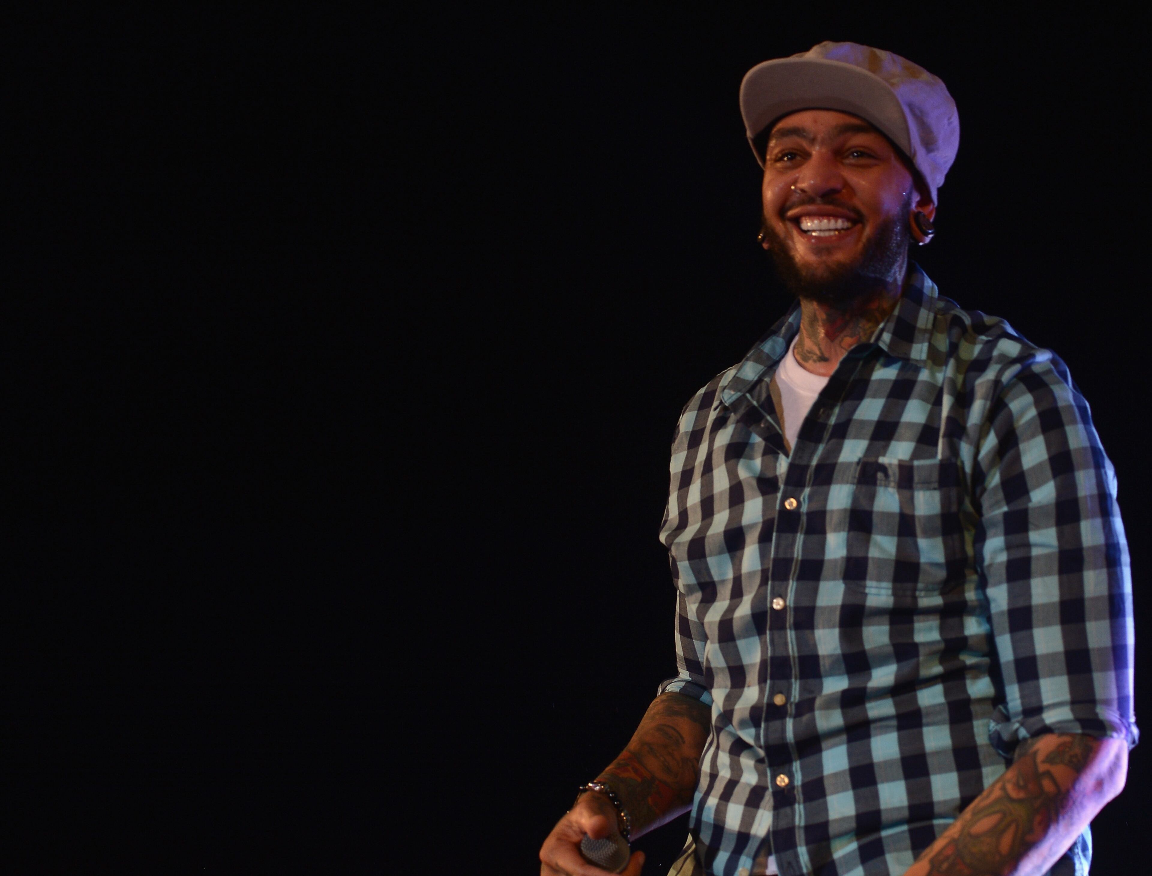 DORAL, FL - MARCH 08: Travie McCoy performs at GREY GOOSE Vodka and the Cadillac Championship Toast Travie McCoy at Trump National Doral on March 8, 2014 in Doral, Florida. (Photo by Gustavo Caballero/Getty Images for GREY GOOSE)