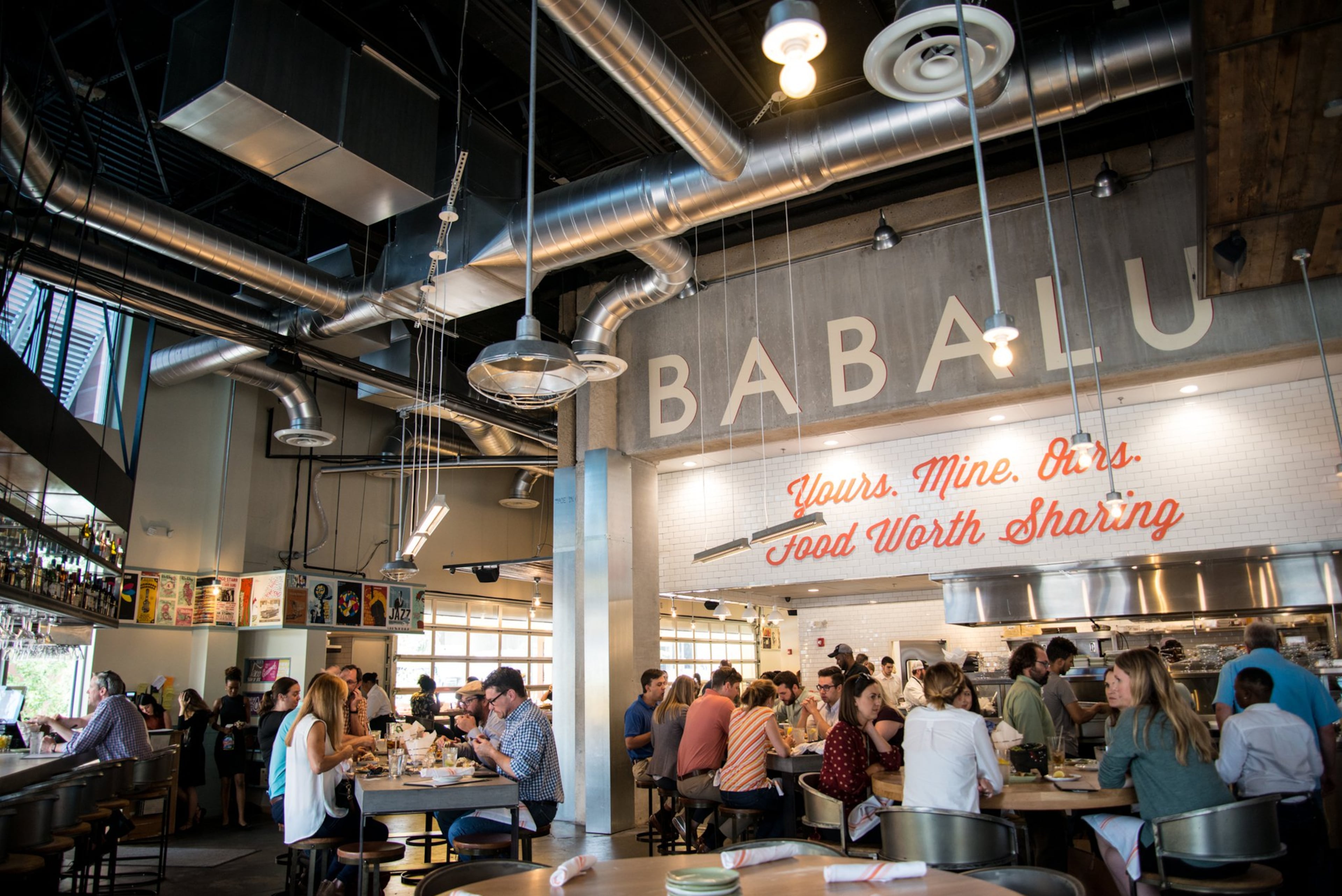The interior architecture from Atlanta’s Seiber Design features an exhibition-style kitchen. Photo credit- Mia Yakel.