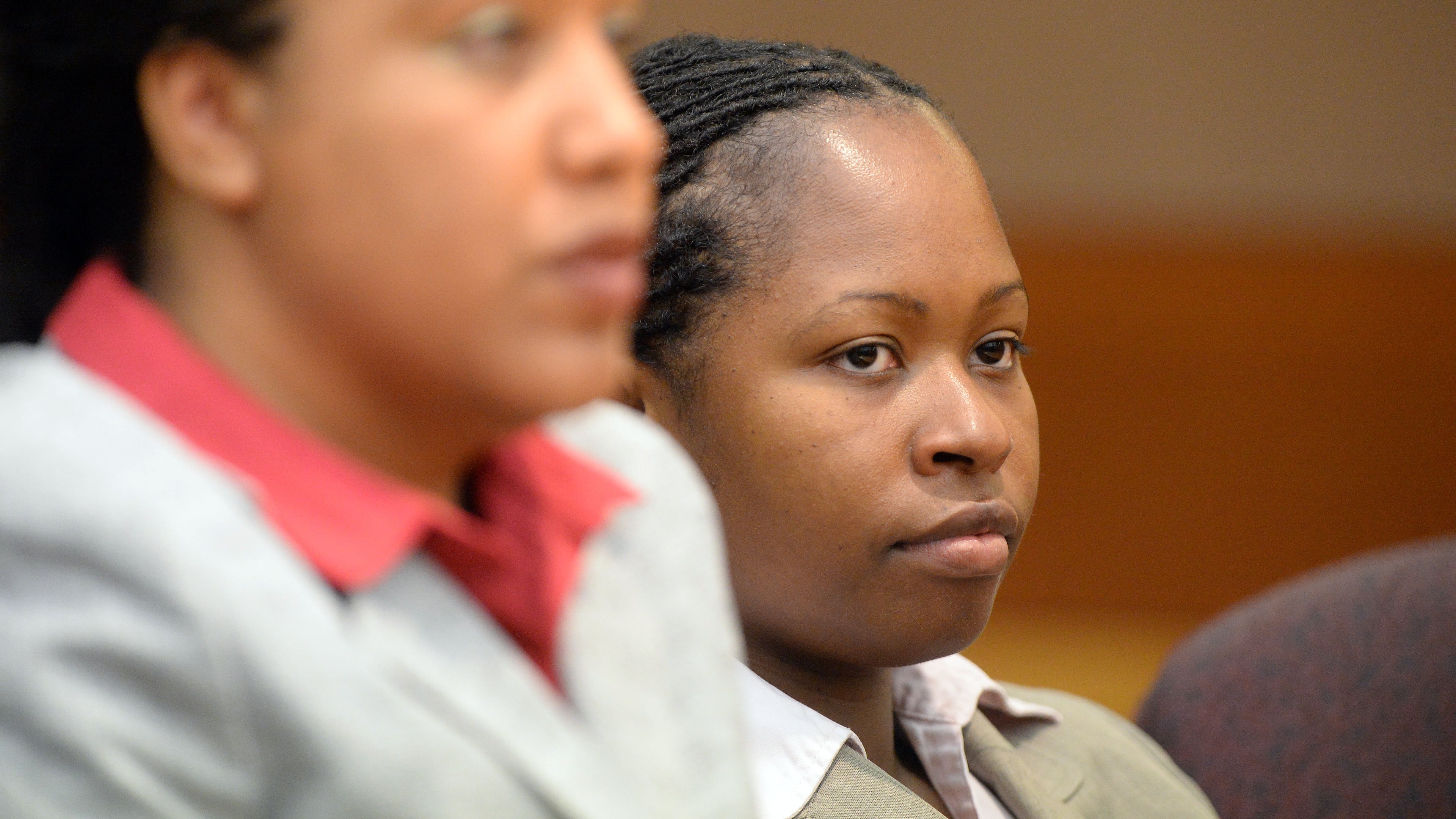 Former APS Dunbar Elementary teacher Shani Robinson (right) listens to appeals in her case during sentencing.