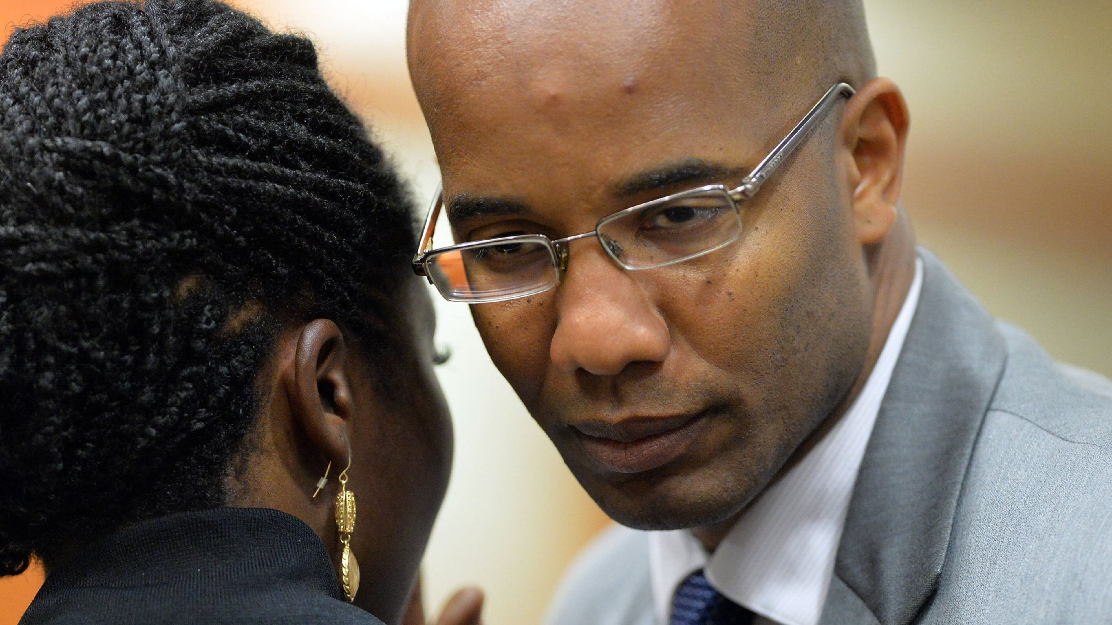 DeKalb County District Attorney Robert James, right, says he will present every officer-involved shooting to a civil grand jury in attempt to seek greater public input on controversial cases. KENT D. JOHNSON /KDJOHNSON@AJC.COM