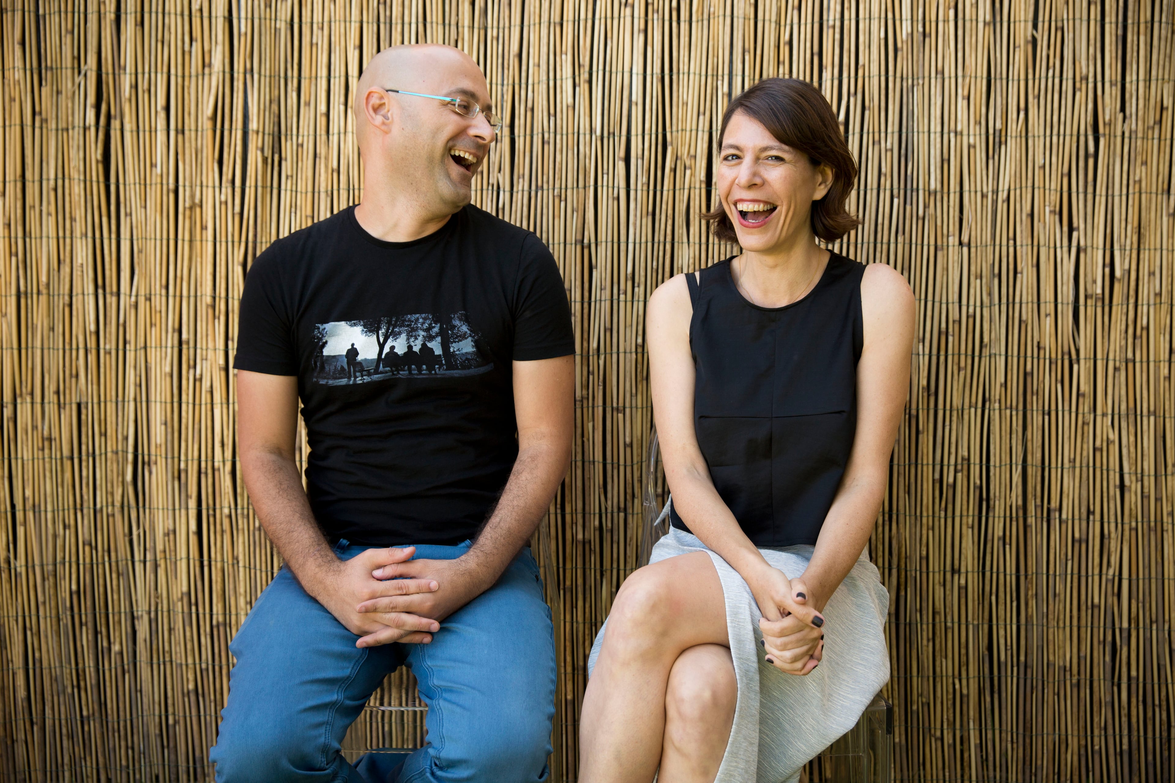 Directors Tal Granit, right, and Sharon Maymon laugh as they pose for photographs following an interview with The Associated Press for their film The Farewell Party, during the 71st edition of the Venice Film Festival in Venice, Italy, Thursday, Aug. 28, 2014. (AP Photo/David Azia)