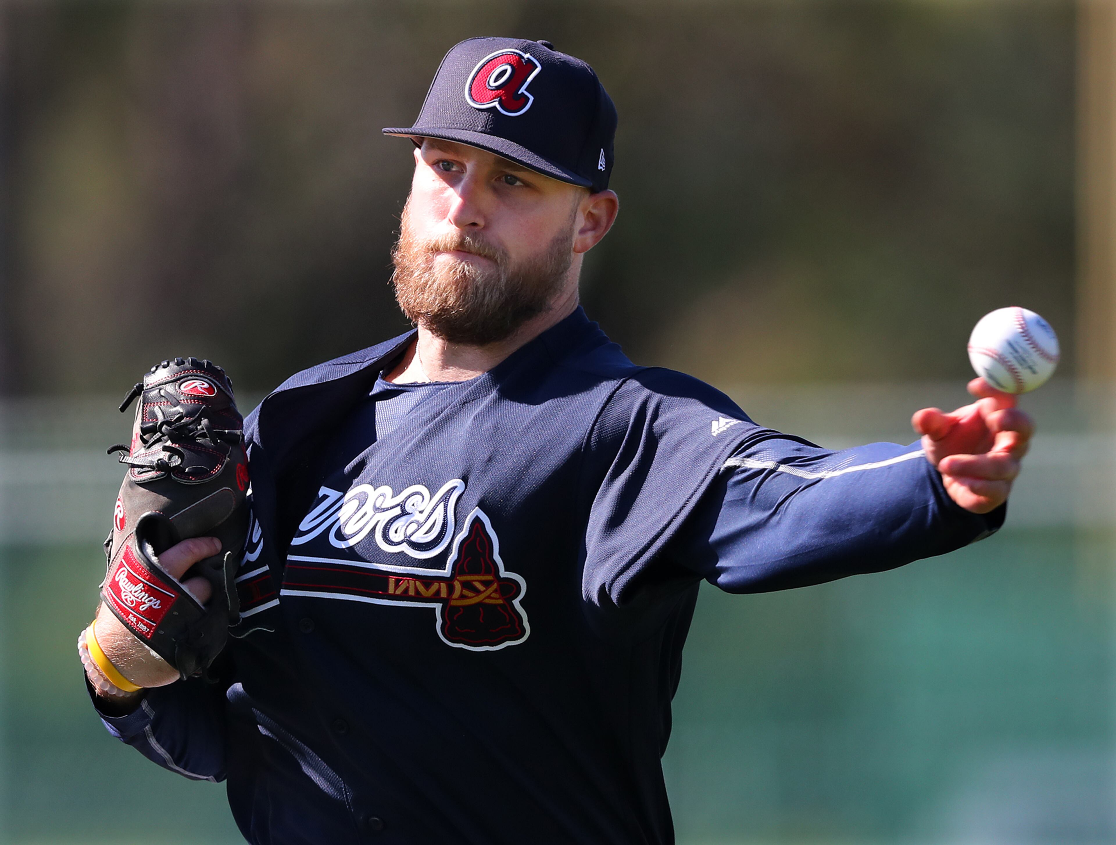 February 16, 2017, Lake Buena Vista, FL: Braves pitcher Ian Krol goes to first after fielding a ground ball on Thursday Feb. 16, 2017, at the ESPN Wide World of Sports in Lake Buena Vista. Curtis Compton/ccompton@ajc.com