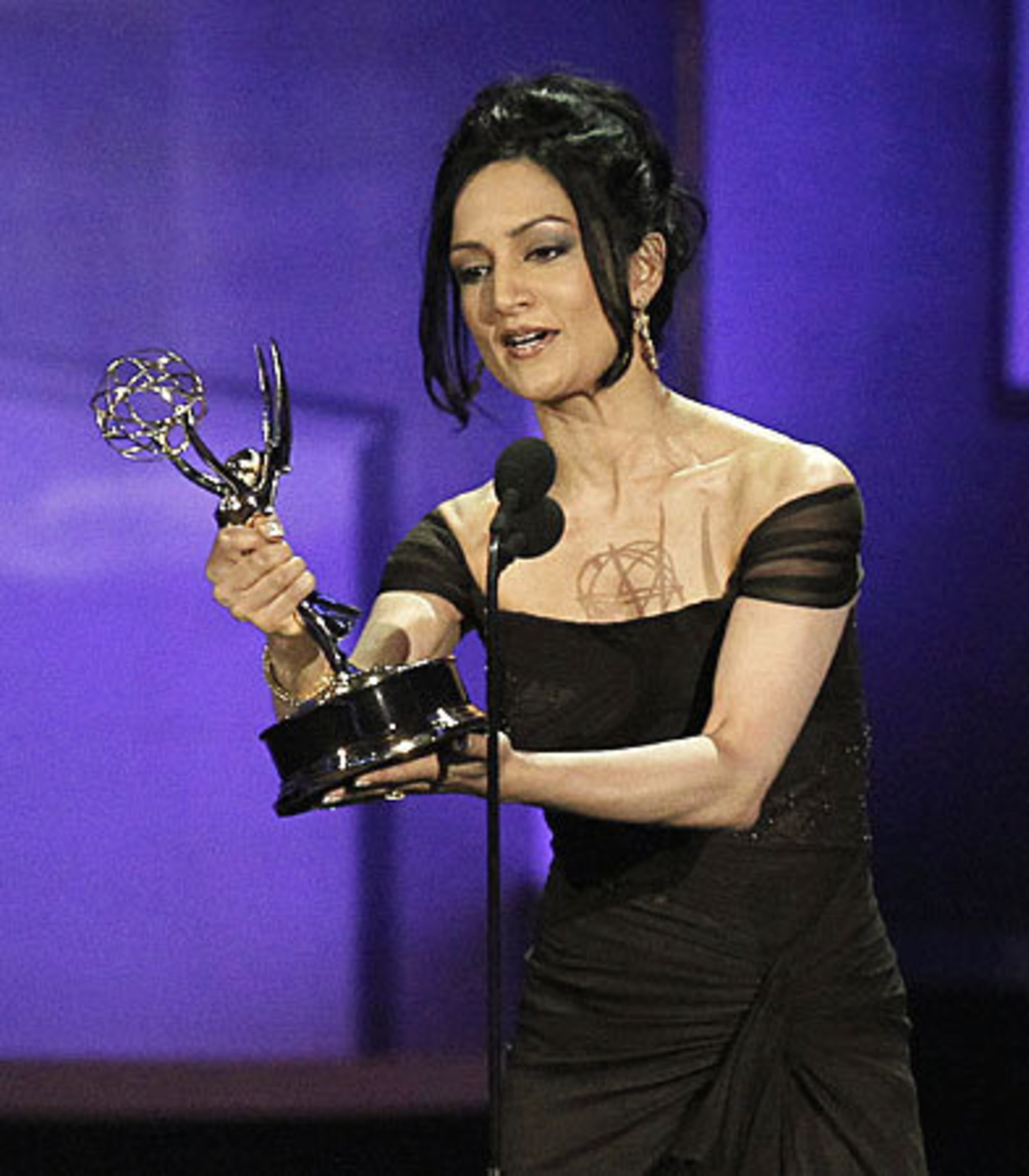 Archie Panjabi accepts the award for outstanding supporting actress in a drama series for "The Good Wife."