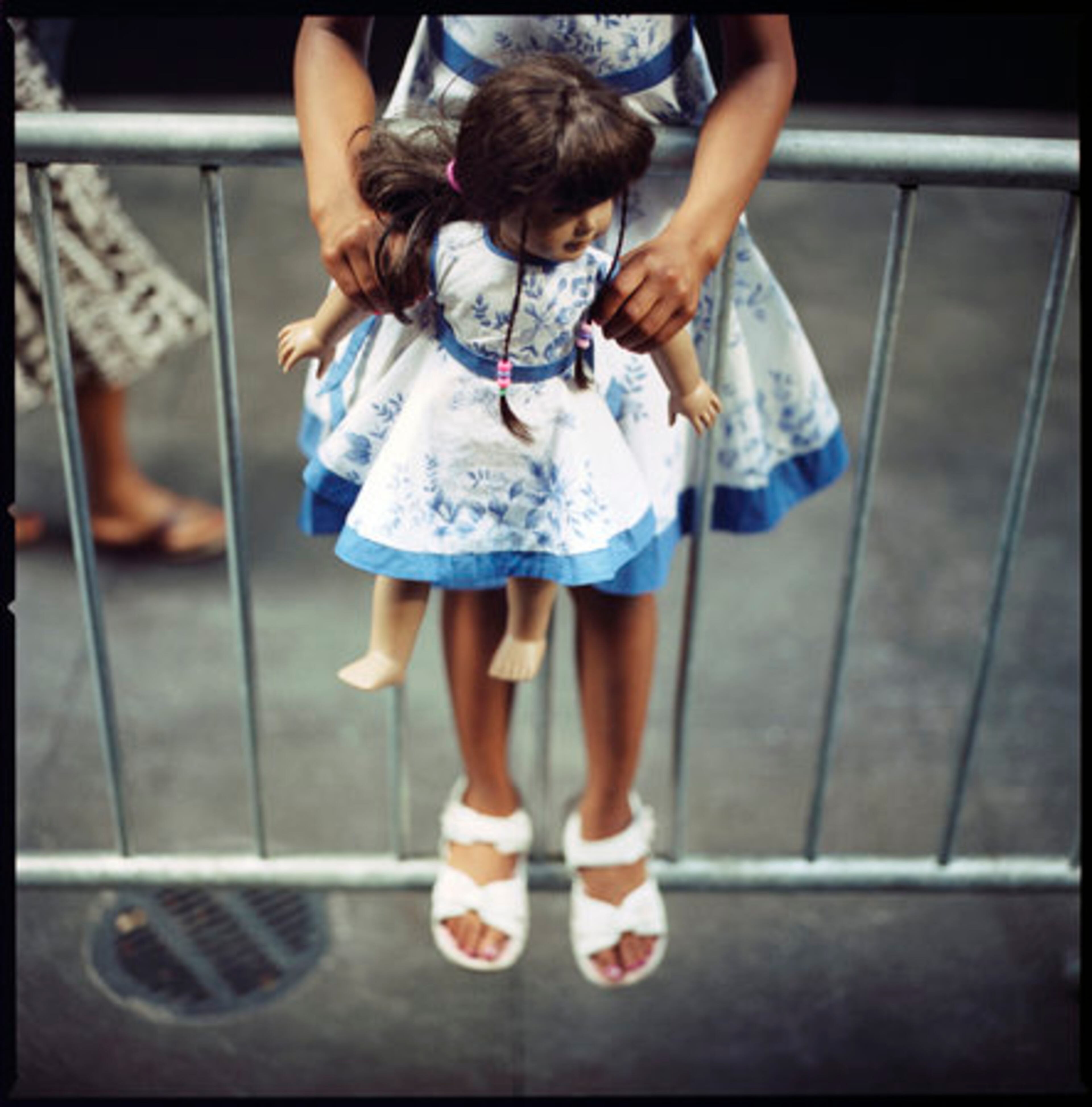 An American Girl doll and owner wearing matching outfits wait at the red carpet premiere for "Kit Kittredge: An American Girl," the latest product in the commercially successful American Girl franchise, at the Zigfeld Theater in Midtown Manhattan, N.Y. this week.