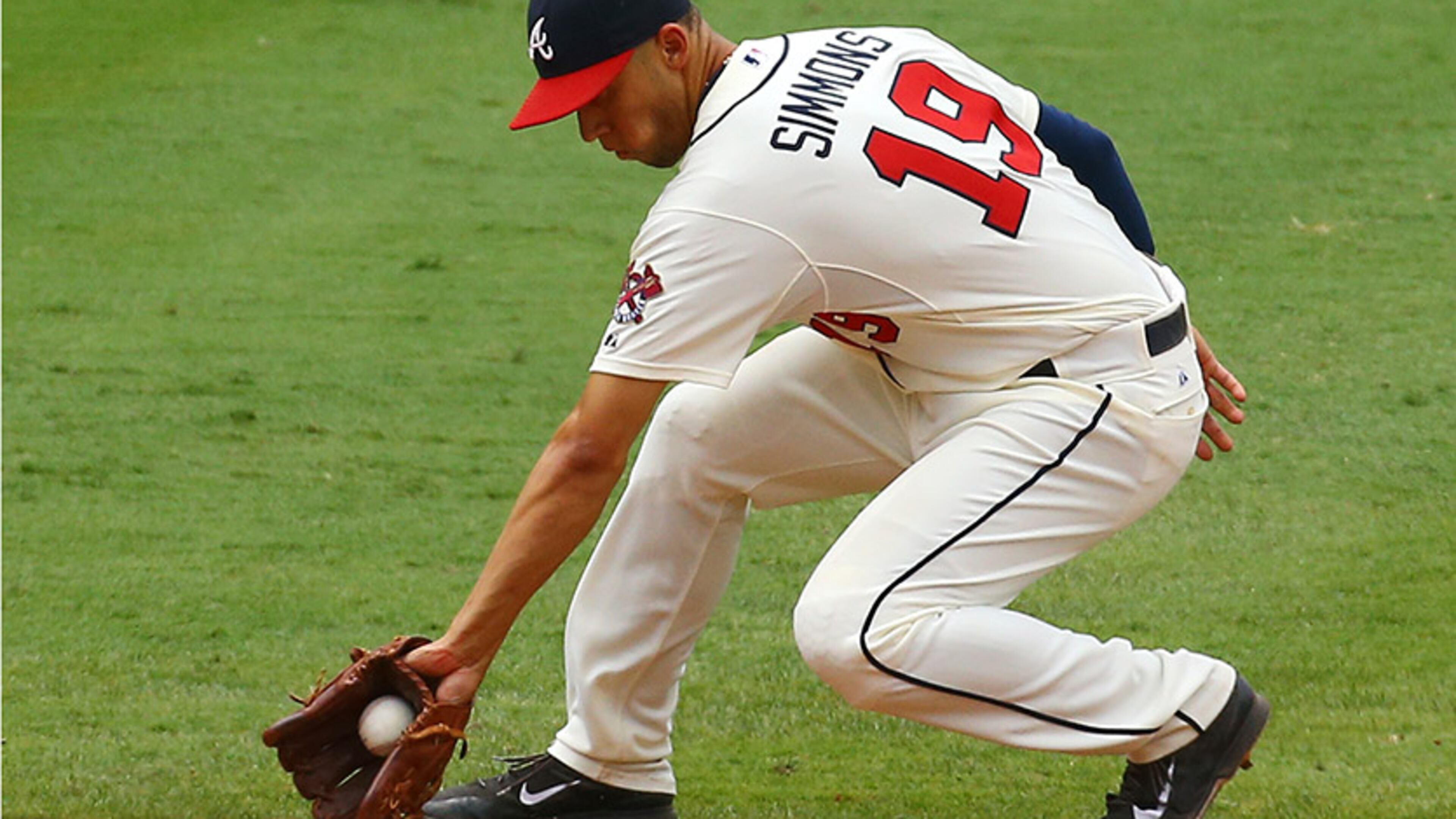 Braves shortstop Andrelton Simmons makes a play on Diamondbacks Cody Ross and turns it for the out during the seventh inning of their MLB game on Sunday, July 6, 2014, in Atlanta. CURTIS COMPTON / CCOMPTON@AJC.COM