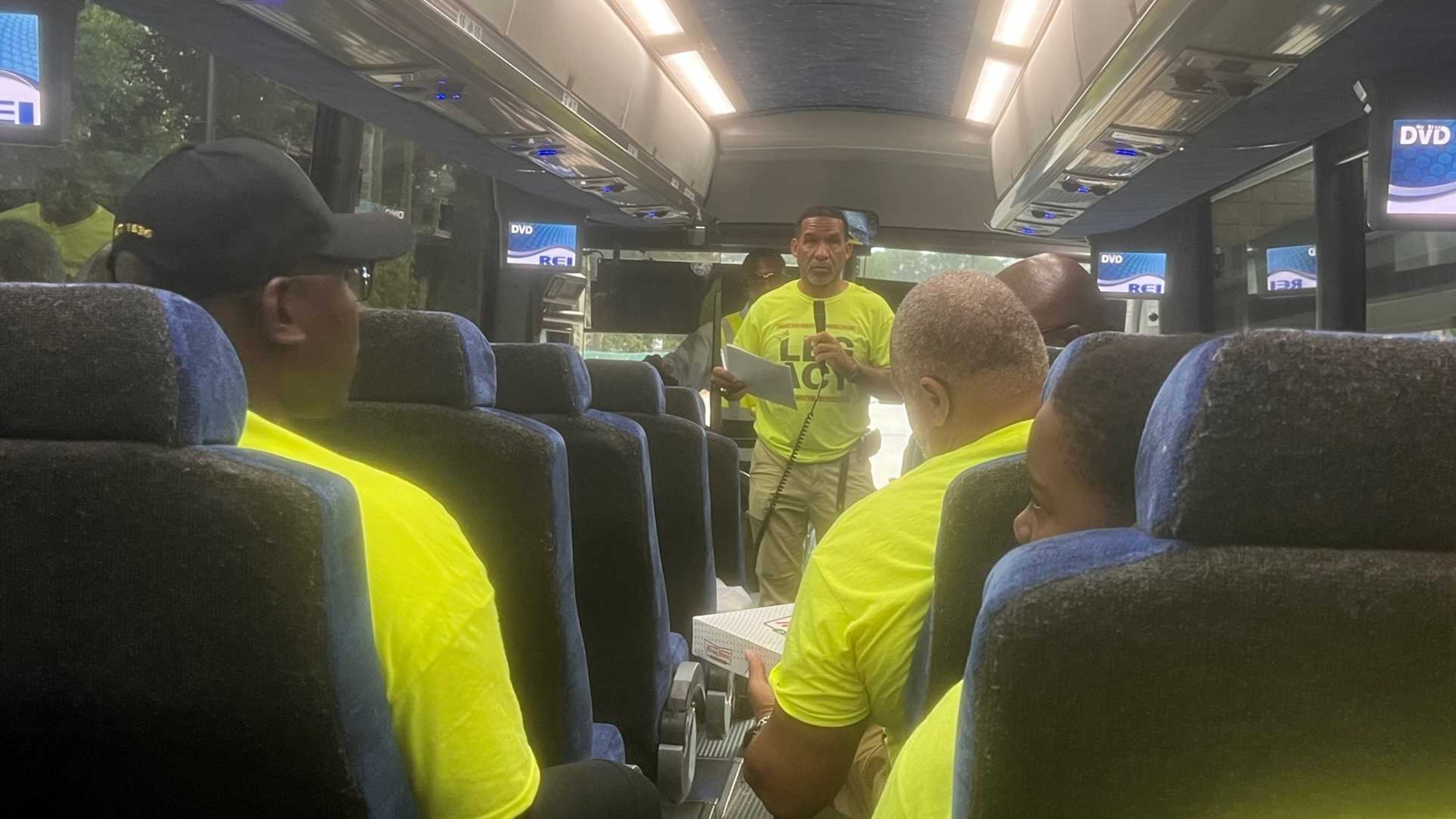 DeKalb County School District math teacher Kevin Rogers gives instructions to Legacy Program students before they travel to Montgomery, Alabama, to visit the Legacy Museum. The trip was the culmination of a two-week summer program aimed at working with Black males in middle school on conflict resolution skills. (Eric Stirgus/eric.stirgus@ajc.com)
