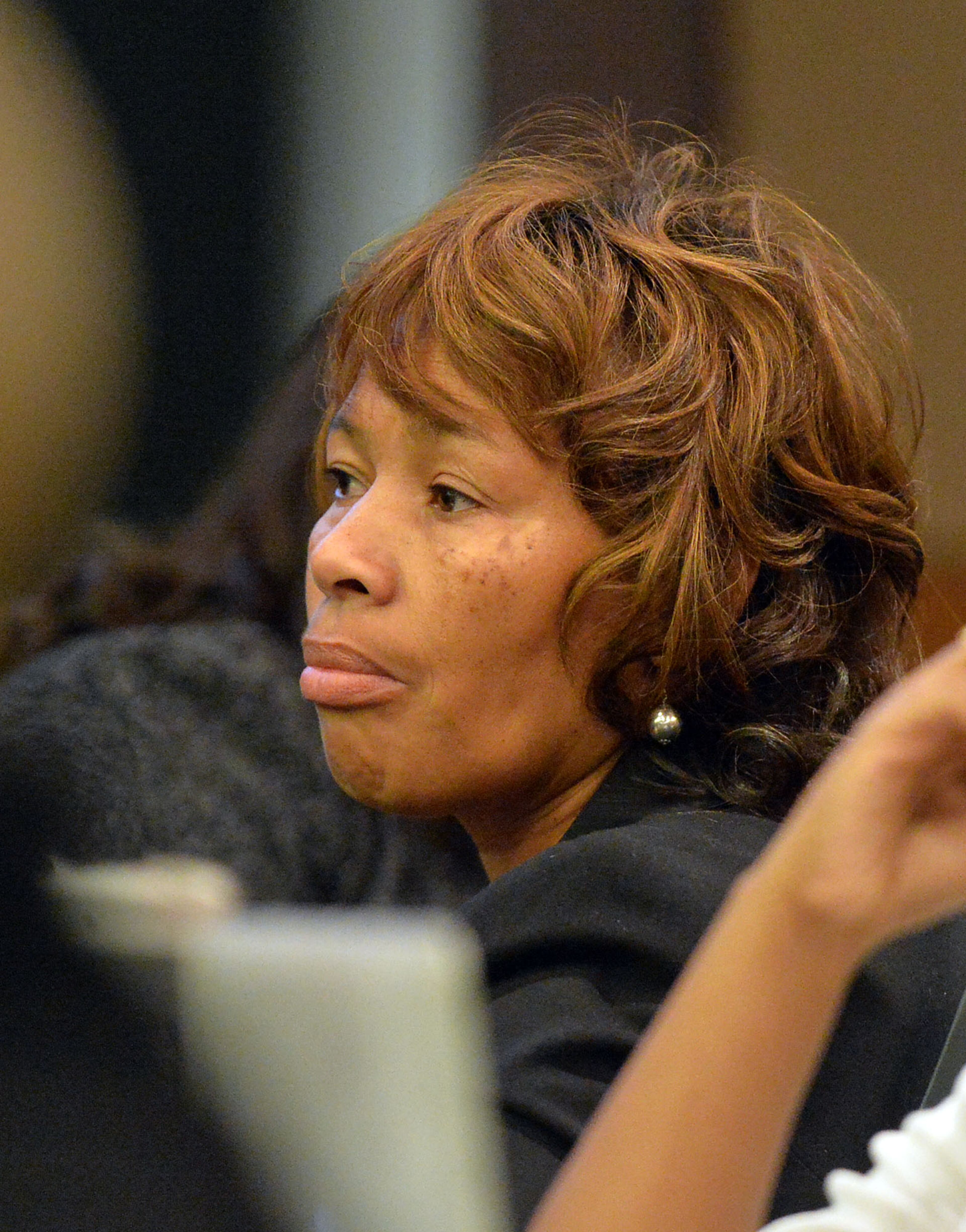 Former APS Dunbar Elementary teacher Pamela Cleveland listens as former Parks Middle School Principal Christopher Waller resumes his testimony under cross examination Tuesday afternoon. KENT D. JOHNSON / KDJOHNSON@AJC.COM