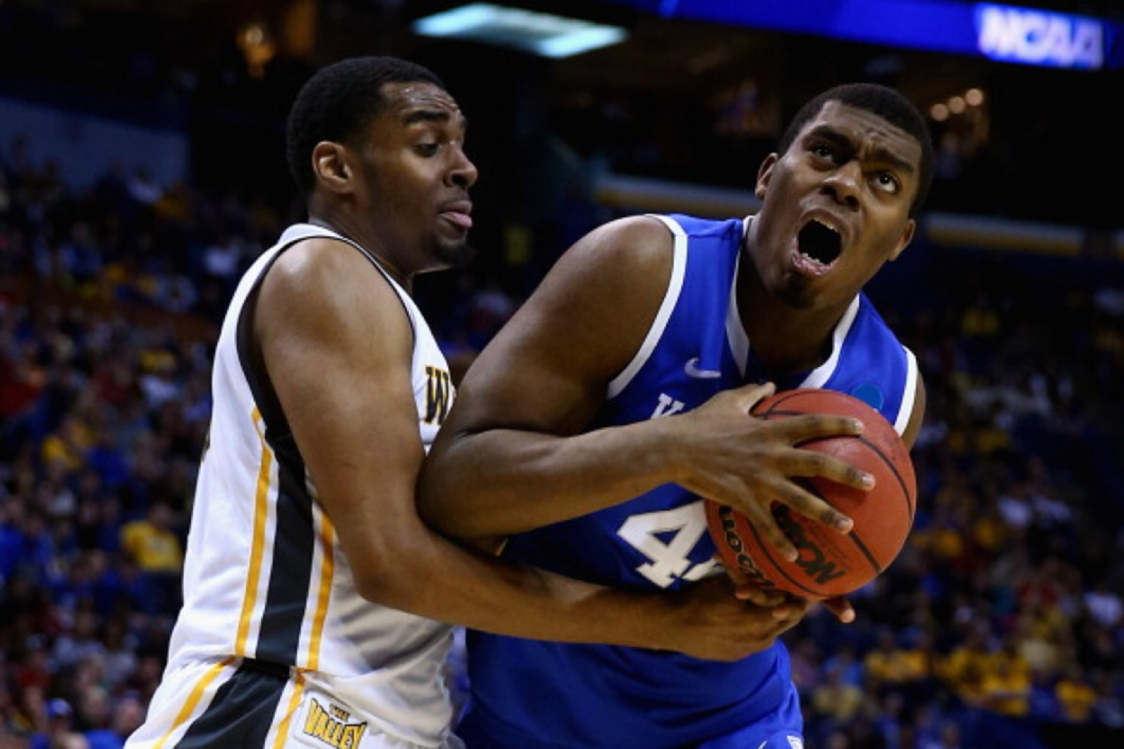 ST LOUIS, MO - MARCH 23: Dakari Johnson #44 of the Kentucky Wildcats drives to the basket against Darius Carter #12 of the Wichita State Shockers during the third round of the 2014 NCAA Men's Basketball Tournament at Scottrade Center on March 23, 2014 in St Louis, Missouri. (Photo by Andy Lyons/Getty Images)