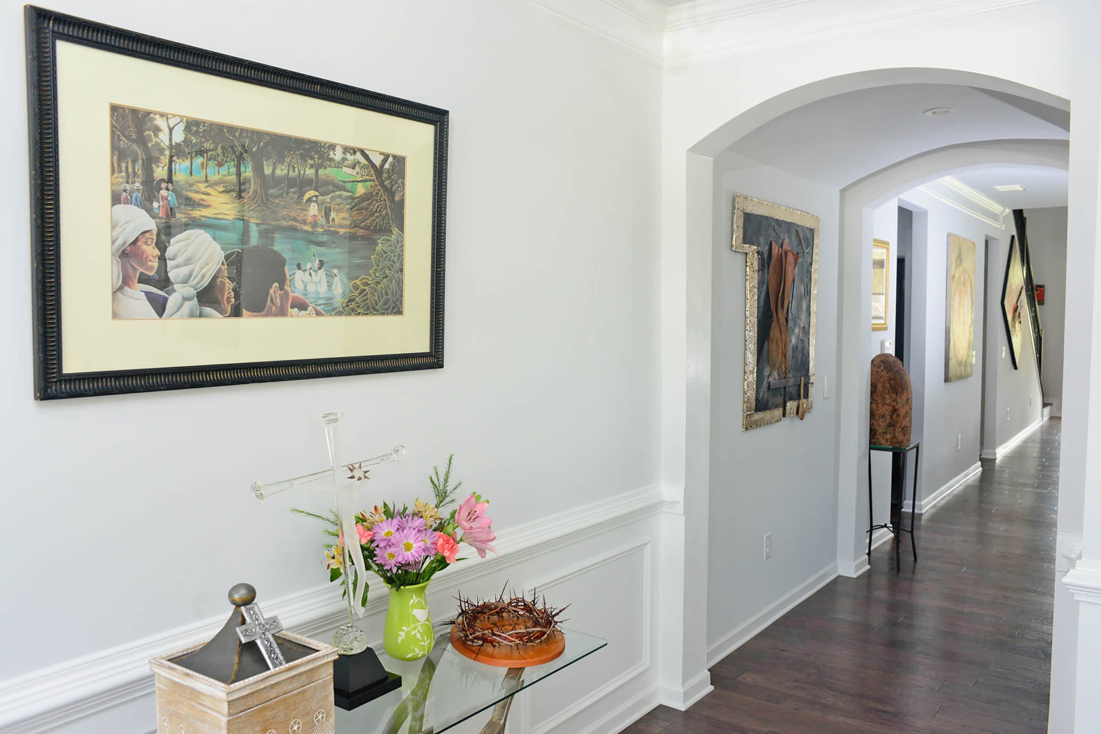 Interior walls in Sherwin-Williams Site White create a clean canvas for displaying art, homeowners Charyl and Anthony Ware say. Their collection includes some pieces by Anthony Ware.
