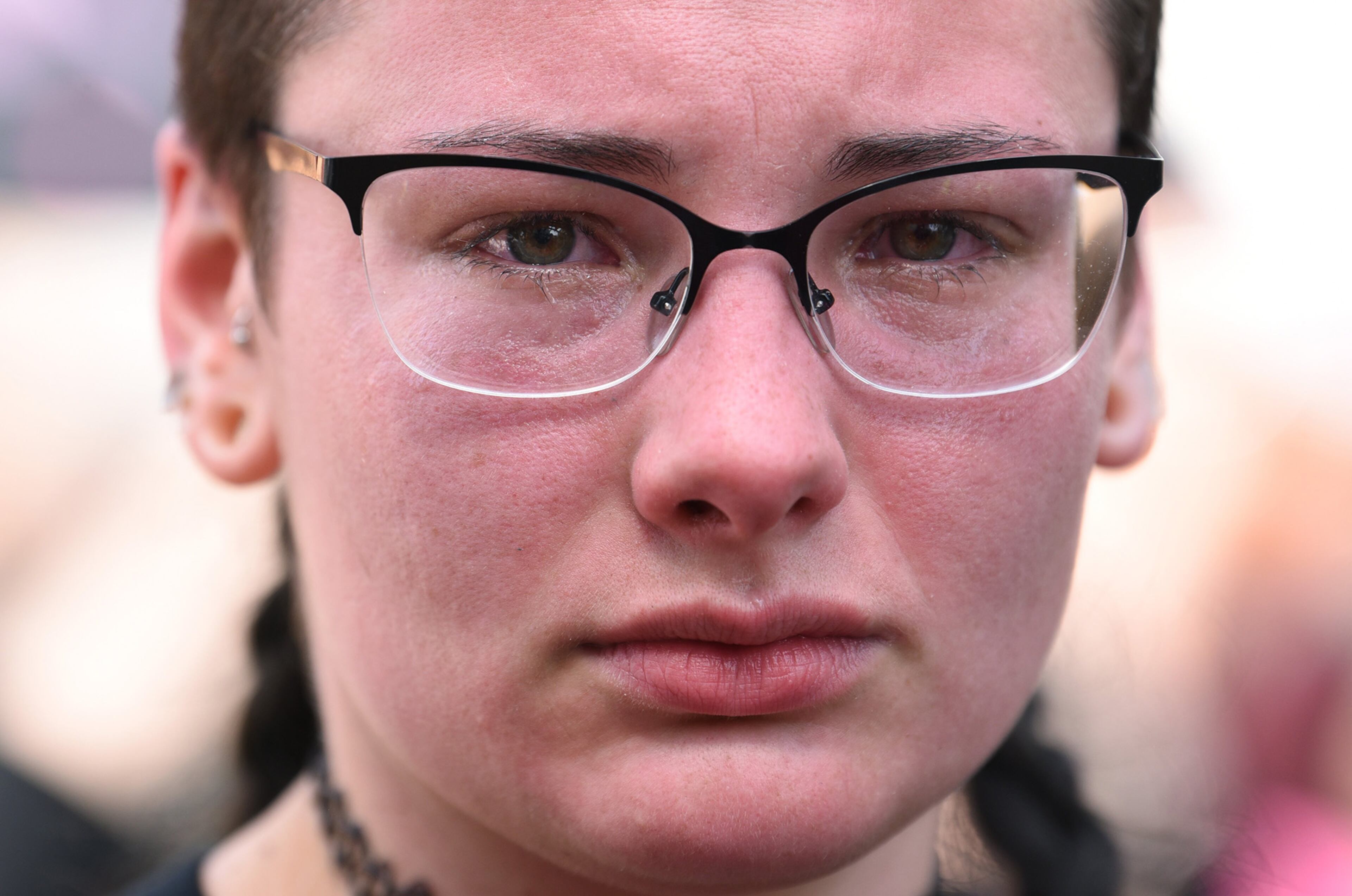 June 3, 2020 Atlanta - A activist canâÃôt hide her emotion as she and other protesters holding signs chant during the sixth consecutive day of protest against police brutality and racism at Centennial Olympic Park on Wednesday, June 3, 2020. The curfew for the city of Atlanta was extended for the next five days, going into effect at 9 p.m. Wednesday. (Hyosub Shin / Hyosub.Shin@ajc.com)