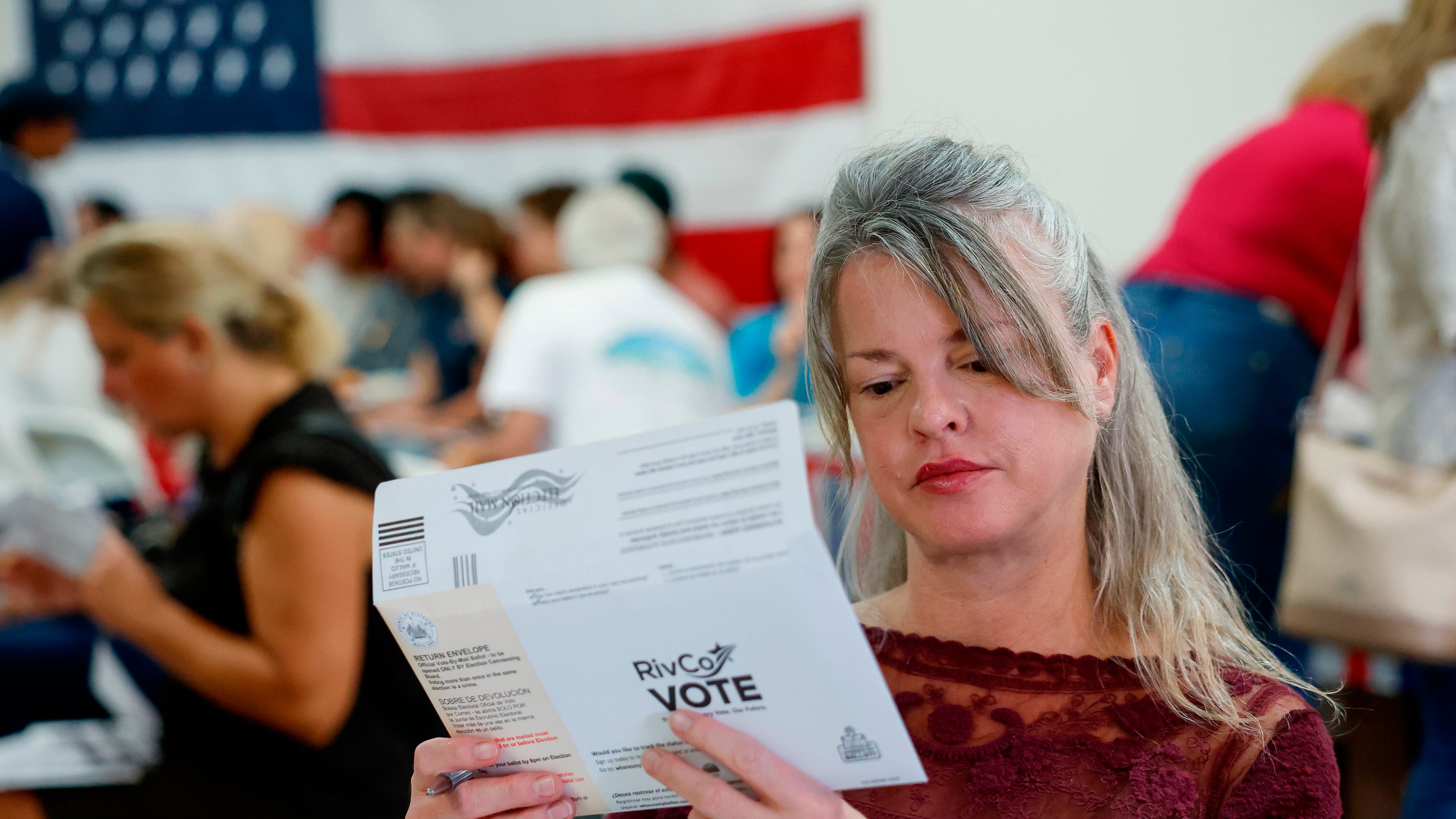 Tiffany Valencia, a Riverside County resident, fills out a primary election ballot during a "Barbeque, Beer and Ballots" event organized by Reform California on Saturday, May 9, 2026, in Corona, Calif. (AP Photo/Caroline Brehman)