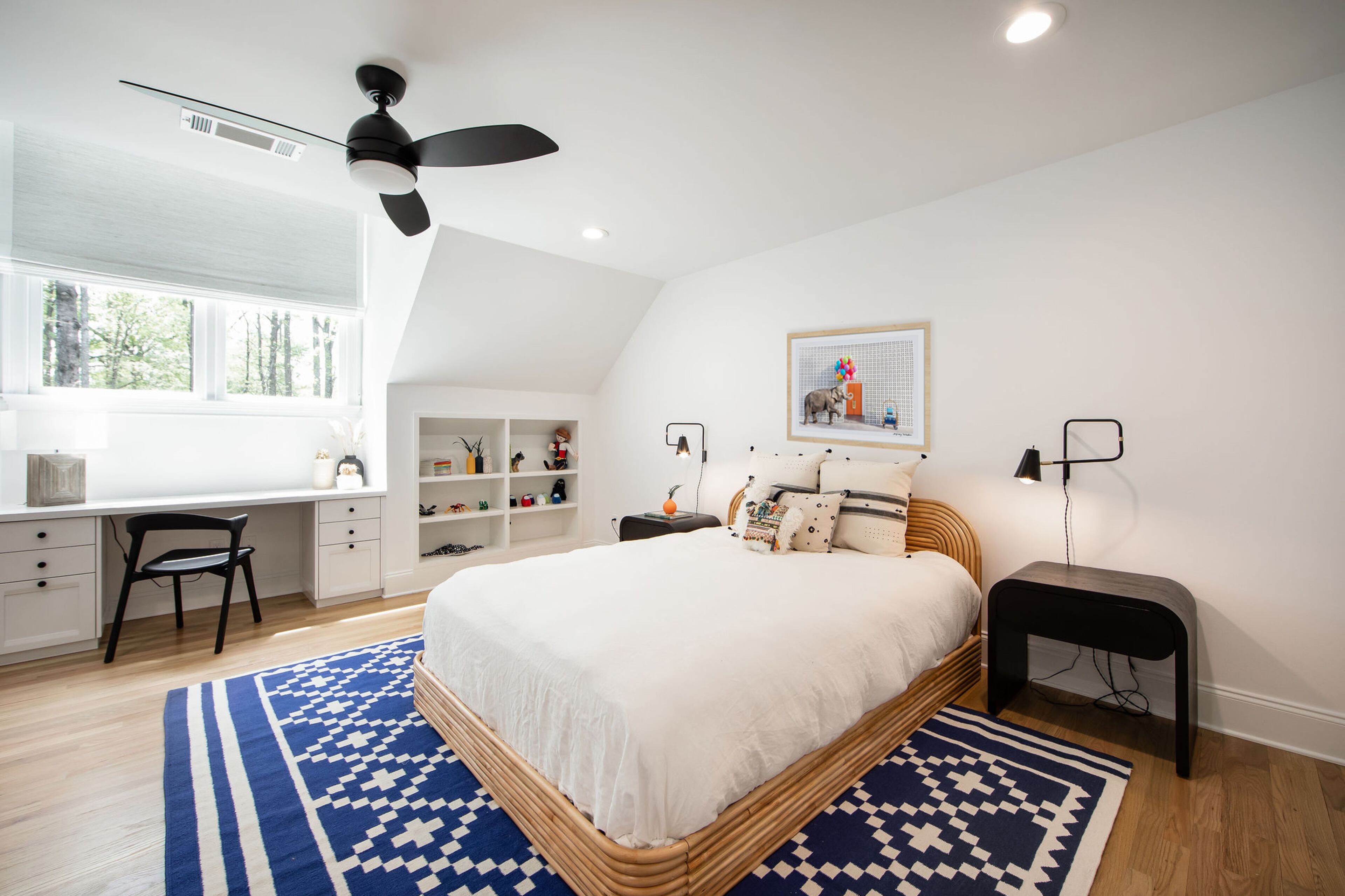 Redmond Nelson’s room was an addition made by the previous homeowner which is roughly the size of their living room, the couple says. Built-in shelving and a sunny desk area complete this youthful, but sophisticated design scheme that leaves plenty of floor space for play — and lets a punchy Aelfie rug steal the show. Text by Lori Keong/Photo by Amanda Winchester