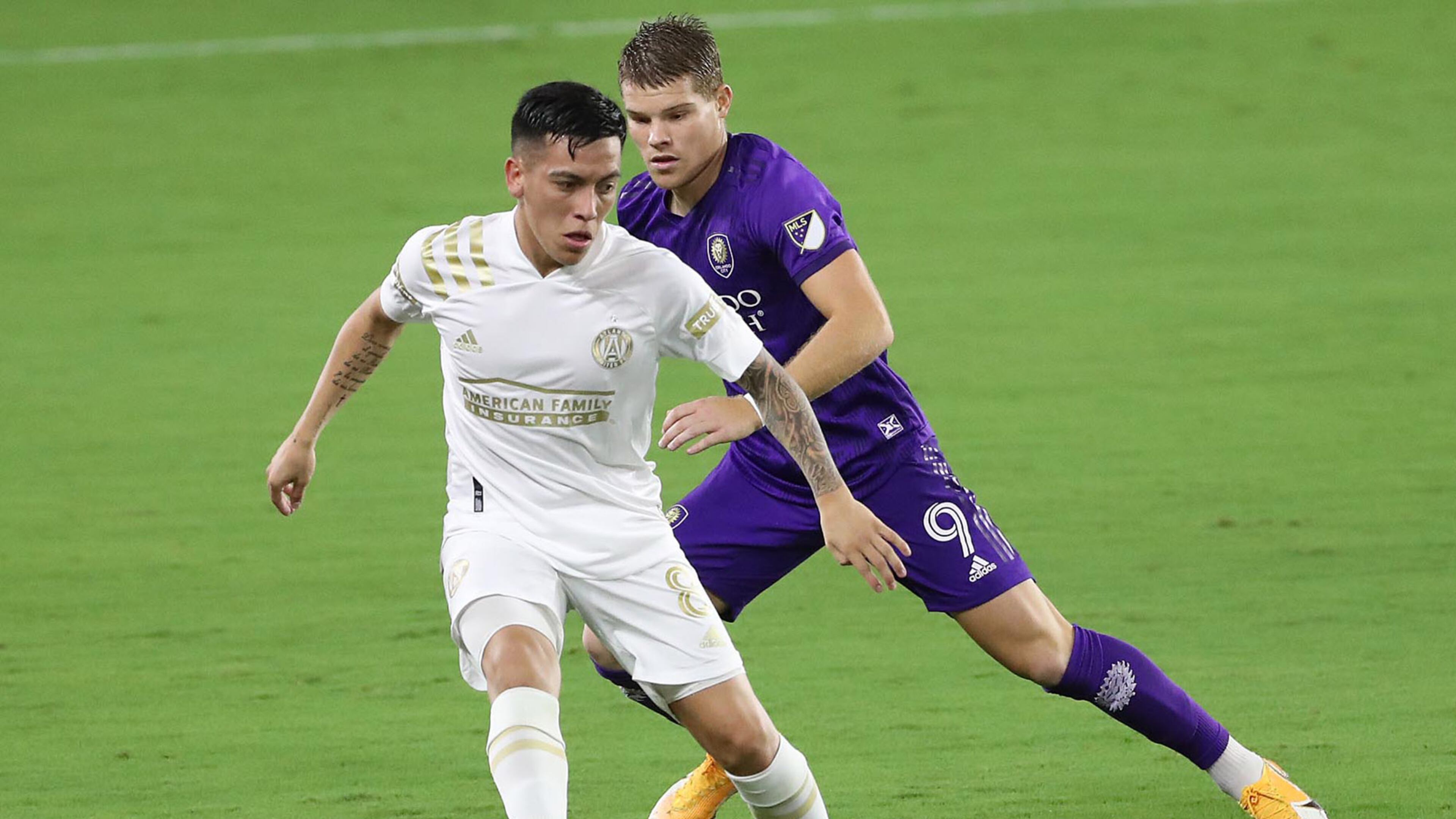 Atlanta United's Ezequiel Barco (8) and Orlando City's Chris Mueller battle for the ball at Exploria Stadium in Orlando, Florida, on Wednesday, Oct. 28, 2020. (Stephen M. Dowell/Orlando Sentinel/TNS)