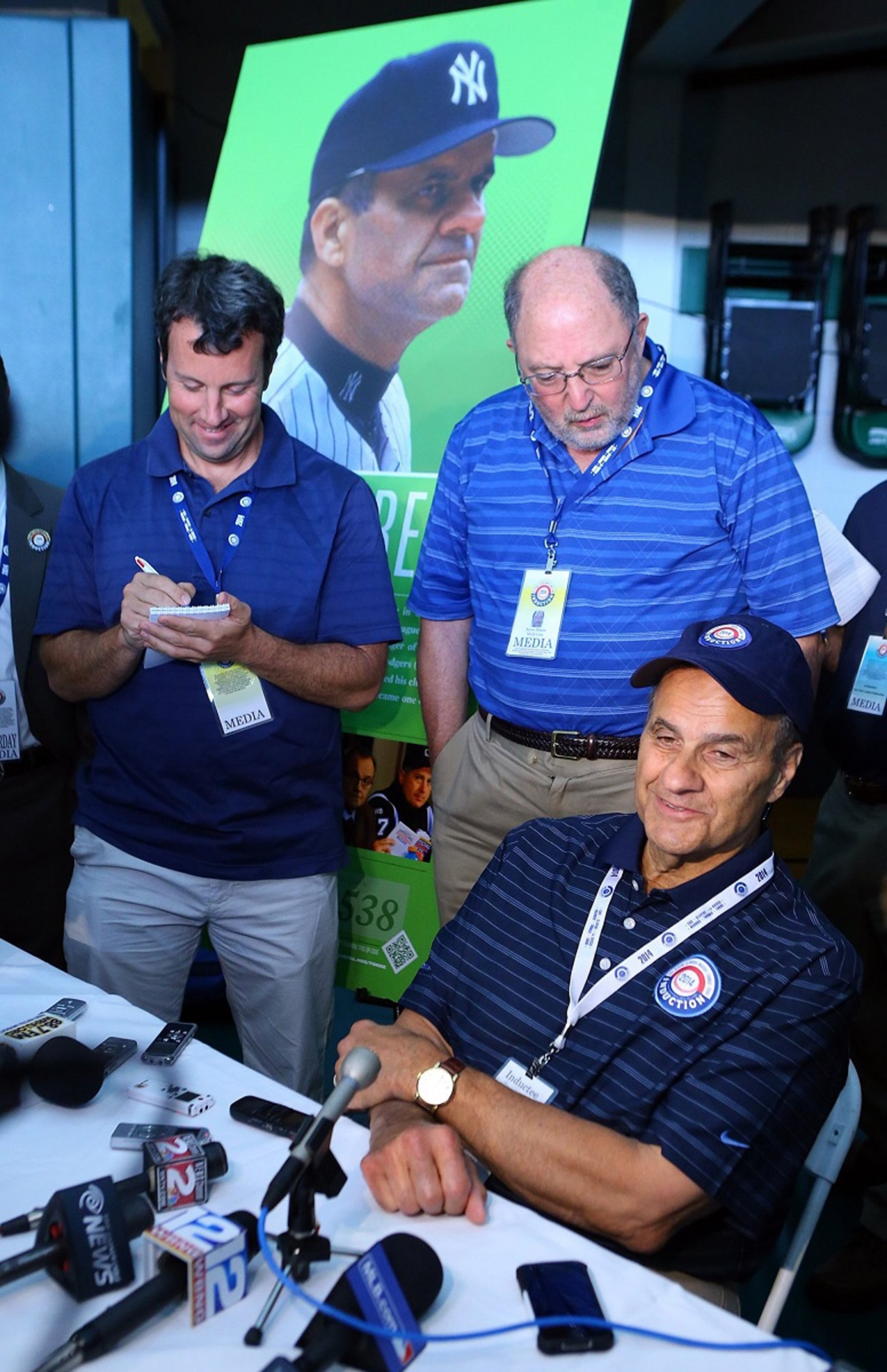 Joe Torre talks to the media.