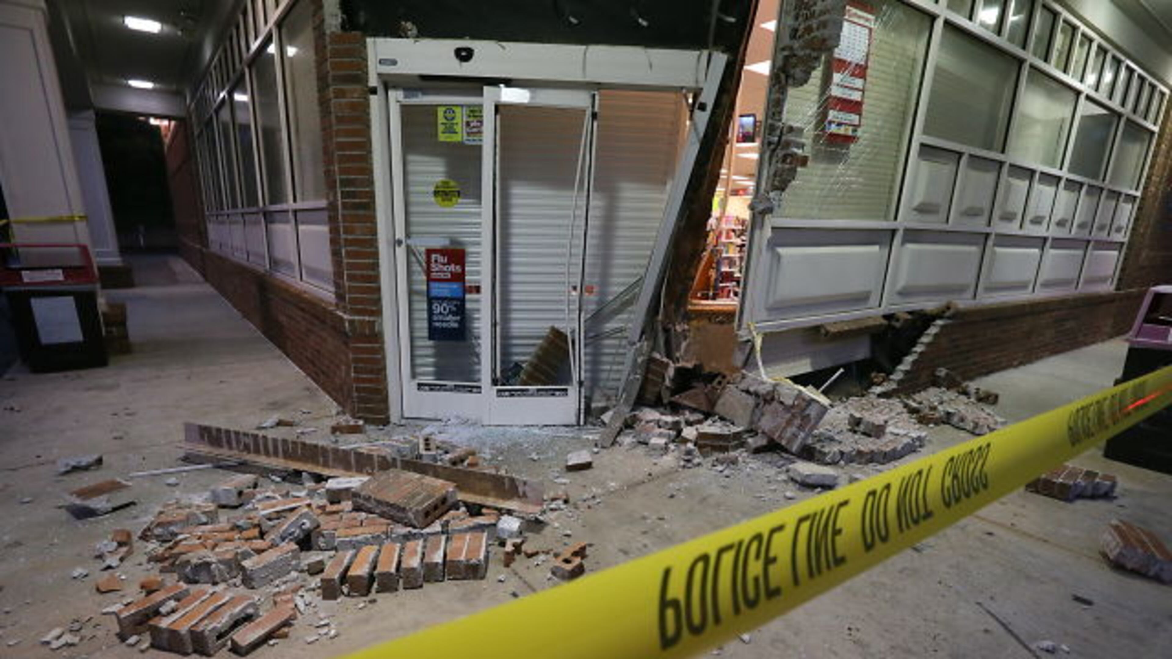 At least one suspect was in custody early Tuesday following the smash-and-grab burglary of a CVS store in southwest Atlanta.