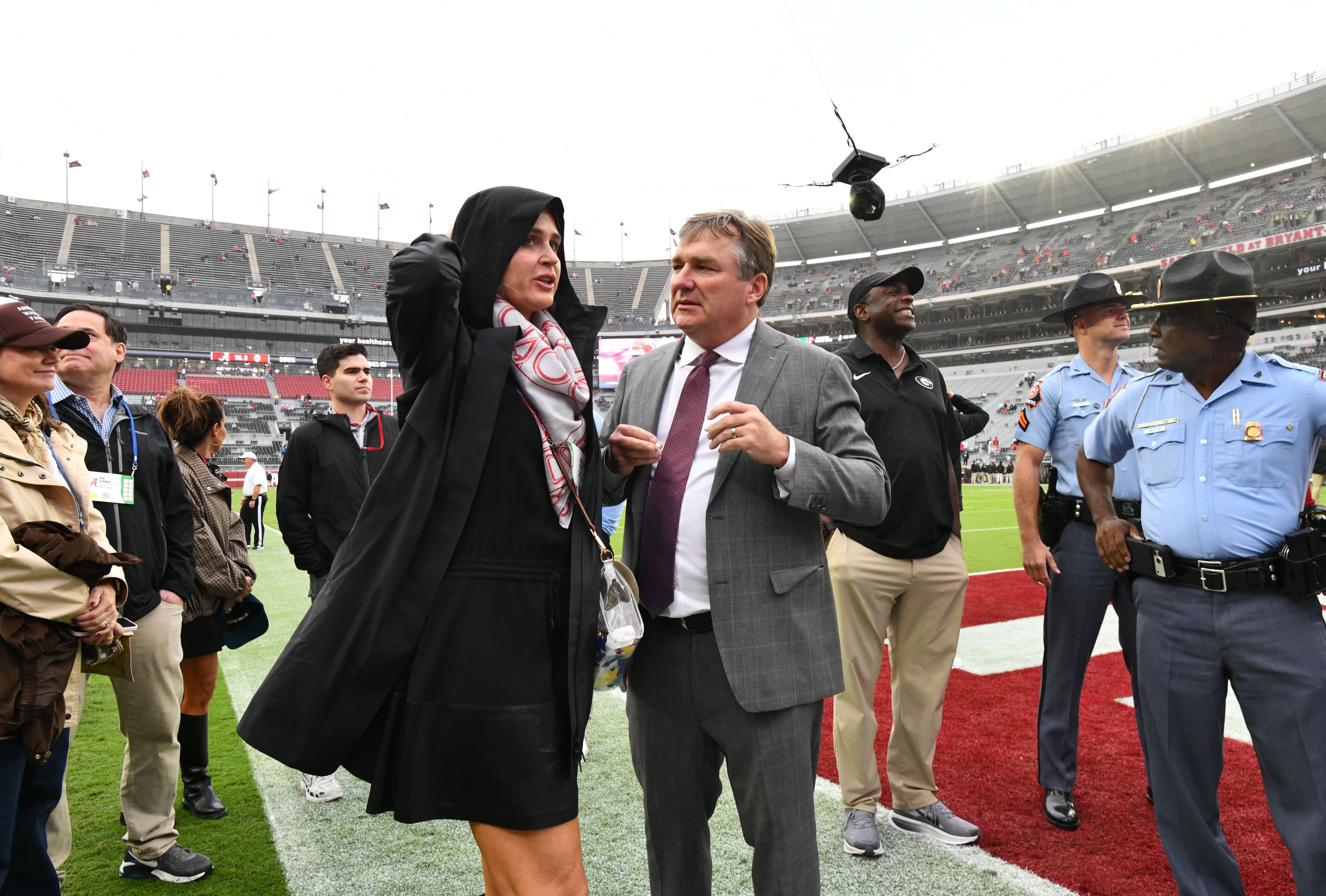 Georgia head coach Kirby Smart talks with his wife Mary Beth as he walks on the field after players and coaching staff arrive before an NCAA football game against Alabama at Bryant-Denny Stadium on Saturday, Oct. 10, 2026, in Tuscaloosa, Alabama. (Hyosub Shin/AJC)