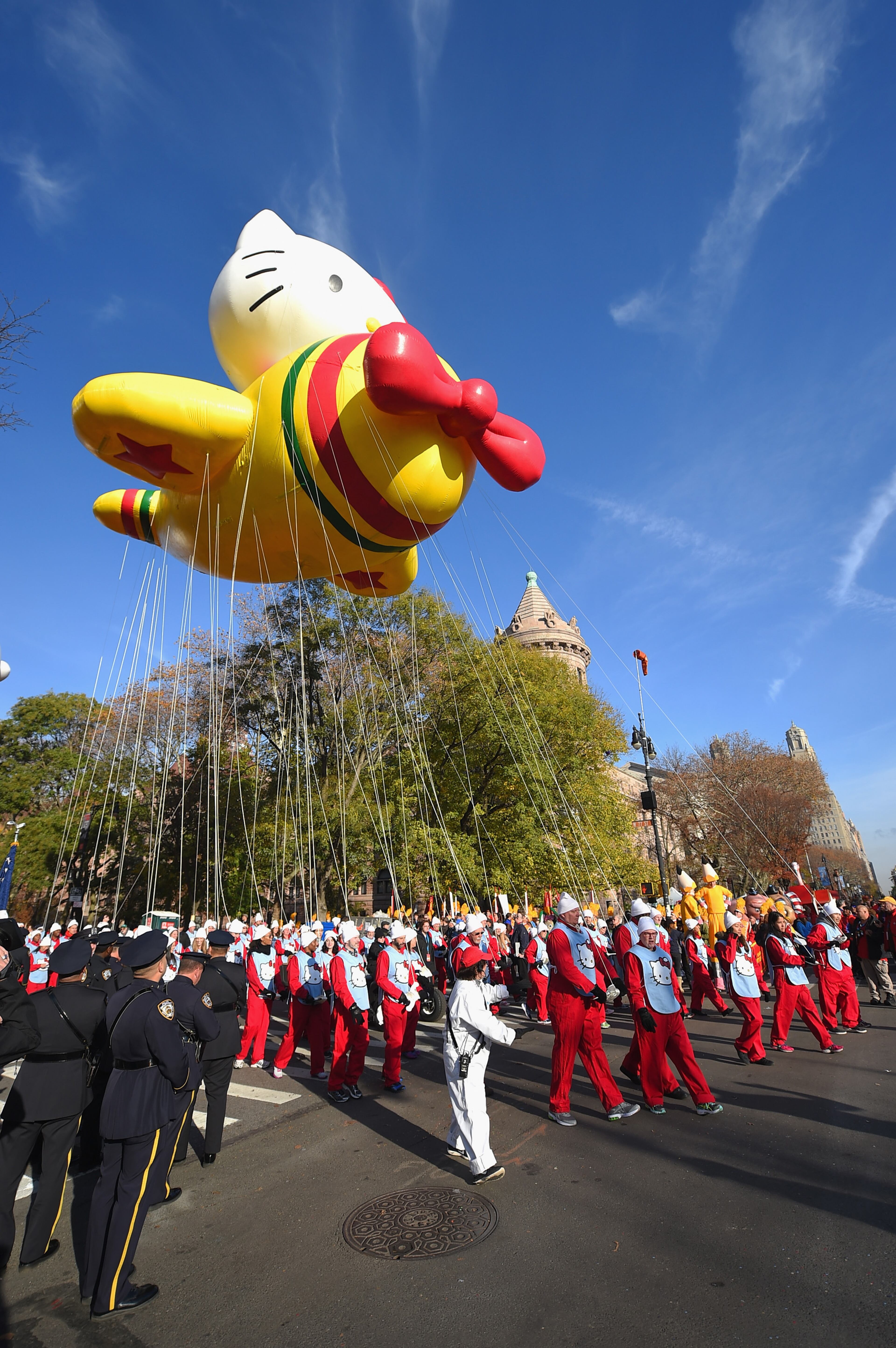NEW YORK, NY - NOVEMBER 26: The Hello Kitty balloon floats through the parade route during the 89th Annual Macy's Thanksgiving Day Parade on November 26, 2015 in New York City. A record number of police officers were patrolling the parade as security is on a high alert after the terror attacks in Paris and threats made to the city. (Photo by Michael Loccisano/Getty Images)