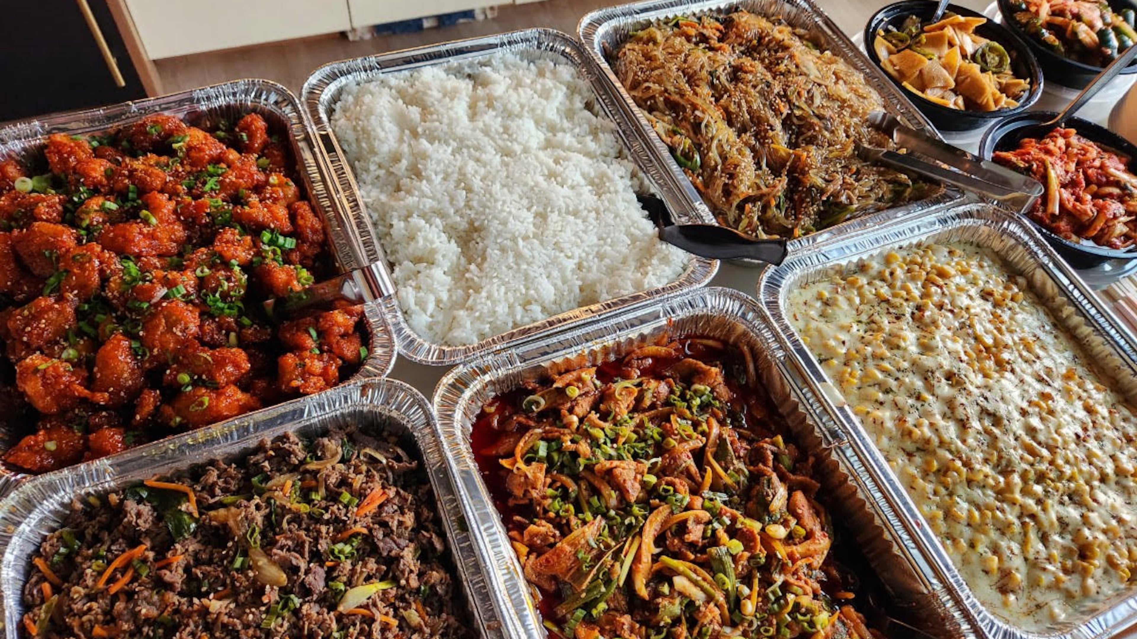 Offerings from Bite of Korea: (top, l-r) Korean fried portobello, rice and japchae and (bottom, l-r) bulgogi beef, jeyuk spicy pork and corn cheese. (Courtesy of Gavin Lee)