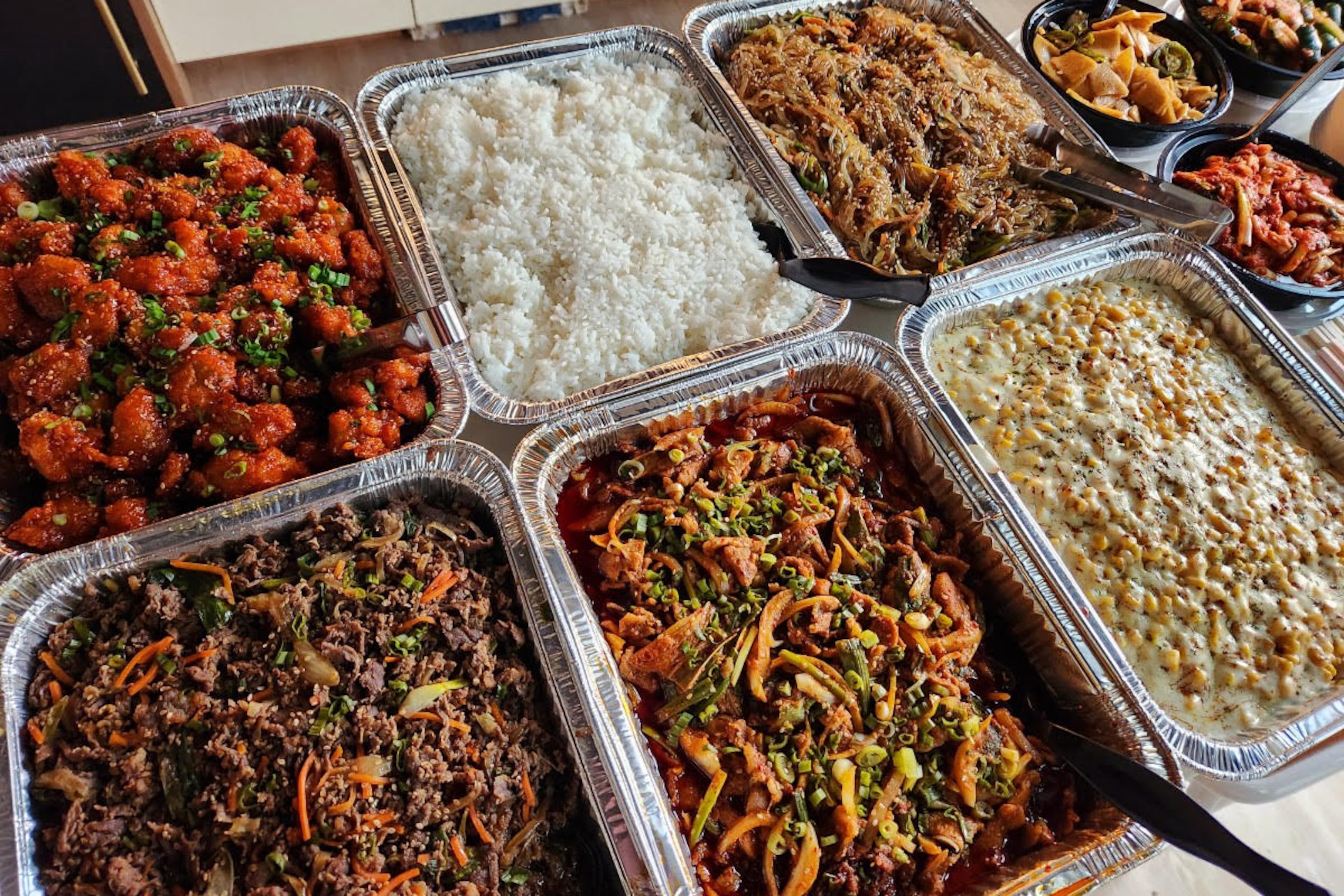 Offerings from Bite of Korea: (top, l-r) Korean fried portobello, rice and japchae and (bottom, l-r) bulgogi beef, jeyuk spicy pork and corn cheese. (Courtesy of Gavin Lee)