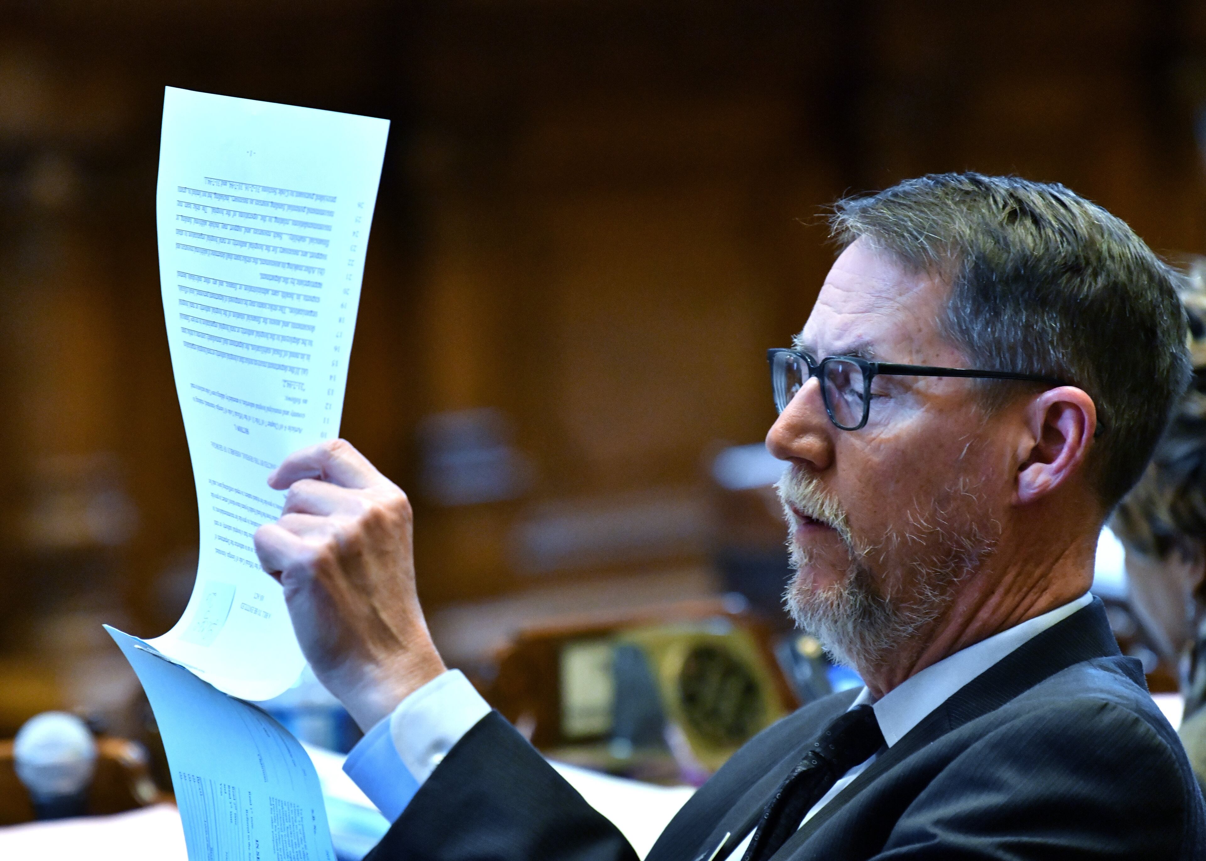 March12, 2020 Atlanta - Senator Dean Burke (District 11) reads a bills as they work on SB 463 (provisions and references regarding direct recording electronic voting machines) during Crossover day at the Georgia State Capitol on Thursday, March 11, 2020. (Hyosub Shin / Hyosub.Shin@ajc.com)