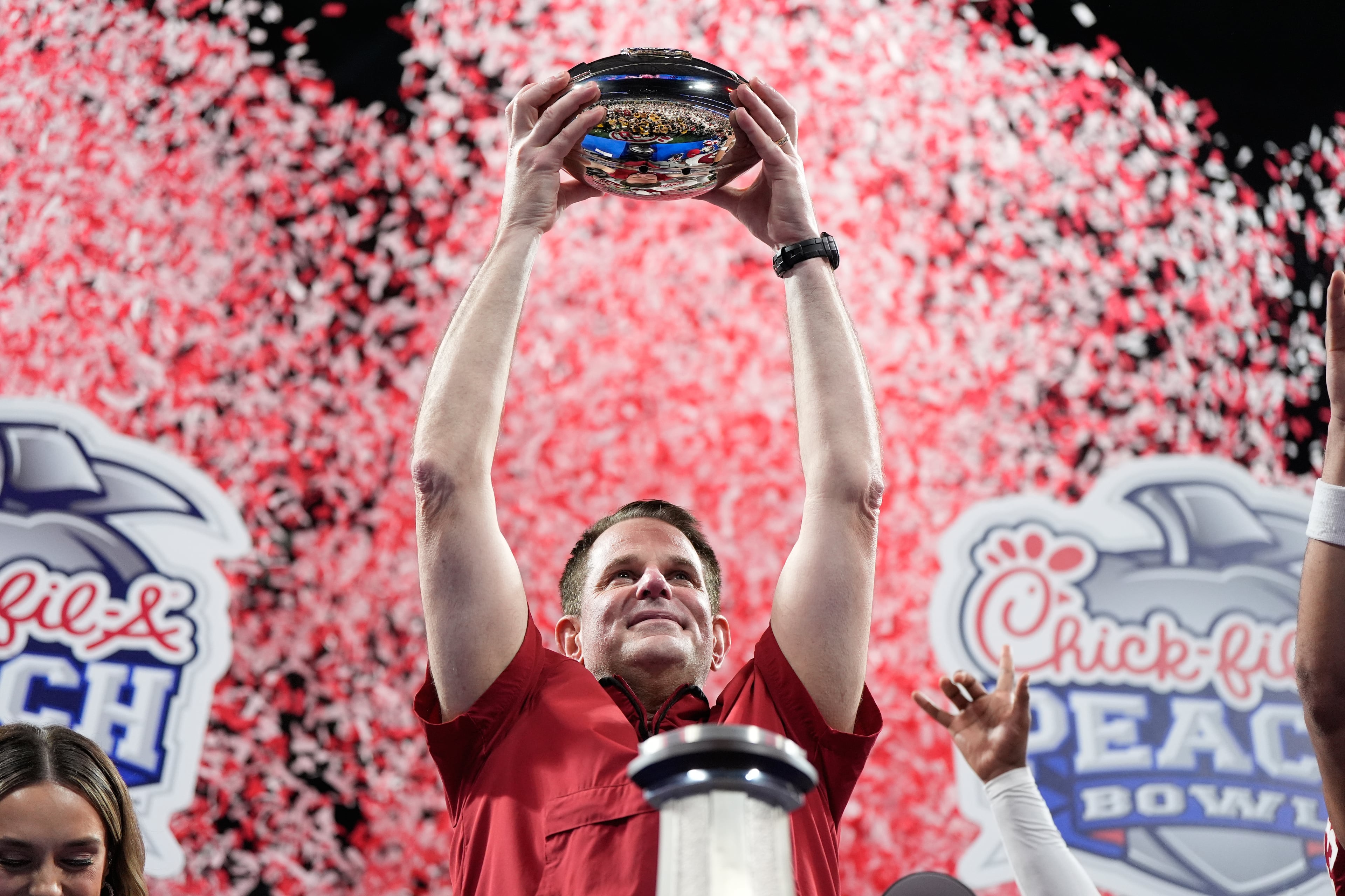 Indiana head coach Curt Cignetti holds up the trophy after their win against Oregon during the Peach Bowl on Friday, Jan. 9, 2026, at Mercedes-Benz Stadium in Atlanta. Indiana football has arrived at the biggest scale. (Brynn Anderson/AP)