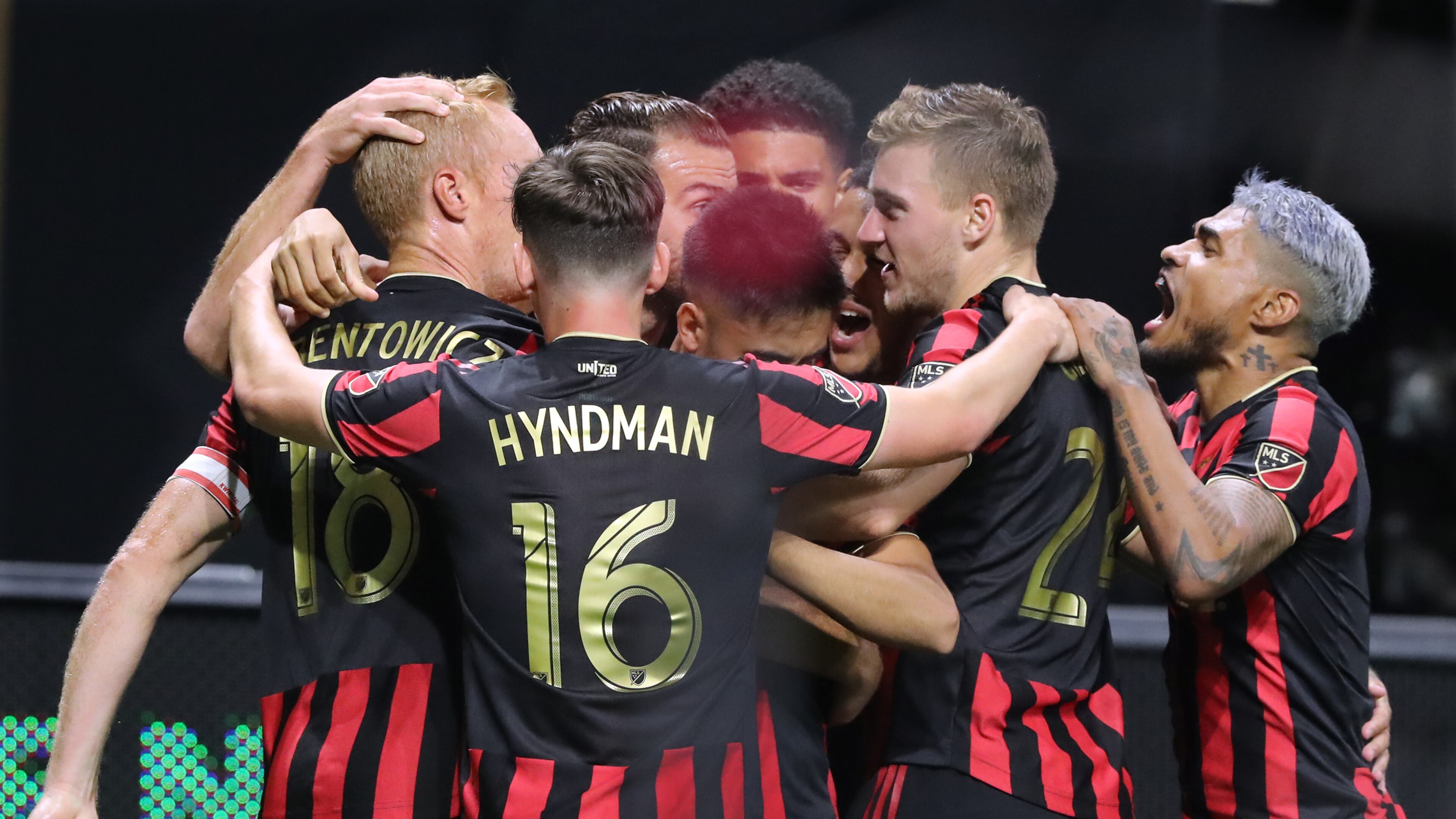 August 14, 2019 Atlanta: Atlanta United captain Jeff Larentowicz (far left) is mobbed by teammates after scoring a goal to tie the game 2-2 with Club America in the Campeones Cup on Wednesday, August 14, 2019, in Atlanta. Curtis Compton/ccompton@ajc.com