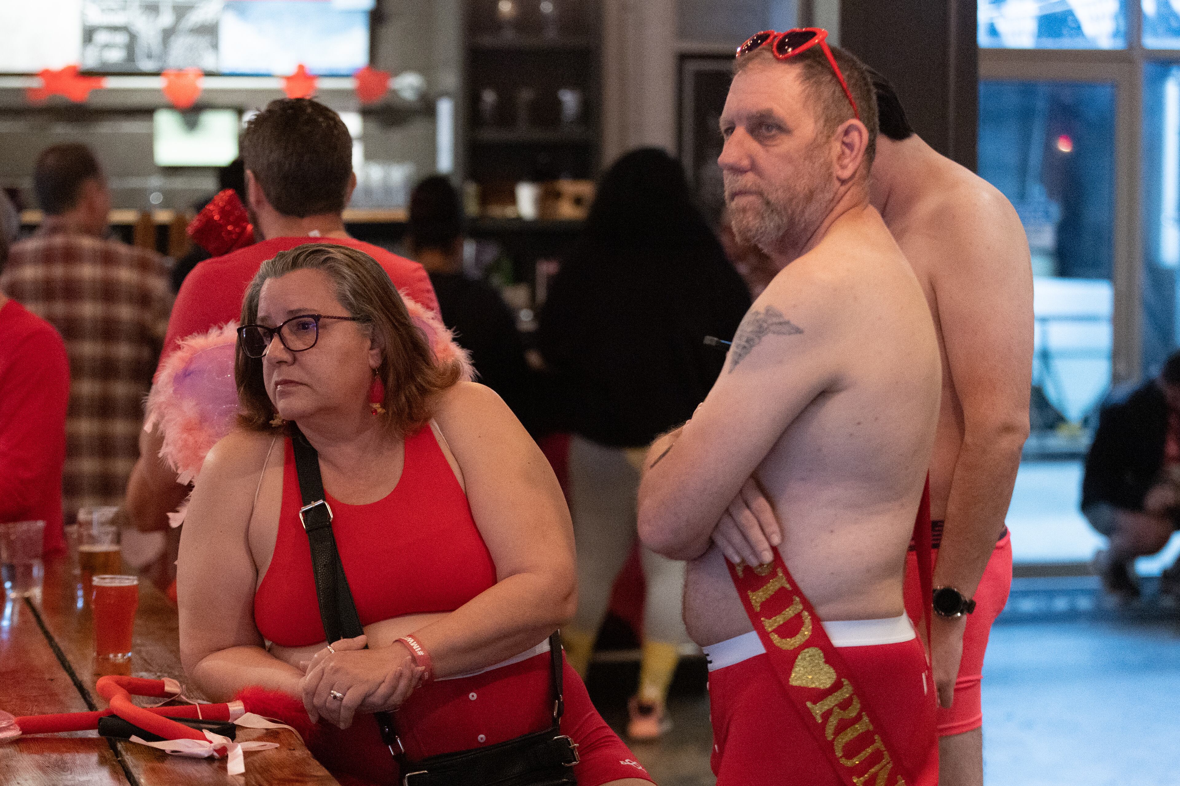 Norm Eation and his wife, Sharon, relax at Eventide Brewing near Grant Park before the start of the Cupid's Undie Run Atlanta 2023 on Saturday, Feb. 11, 2023. Runners raise funds to support people affected by the genetic disorder neurofibromatosis. (Photo: Steve Schaefer / steve.schaefer@ajc.com)