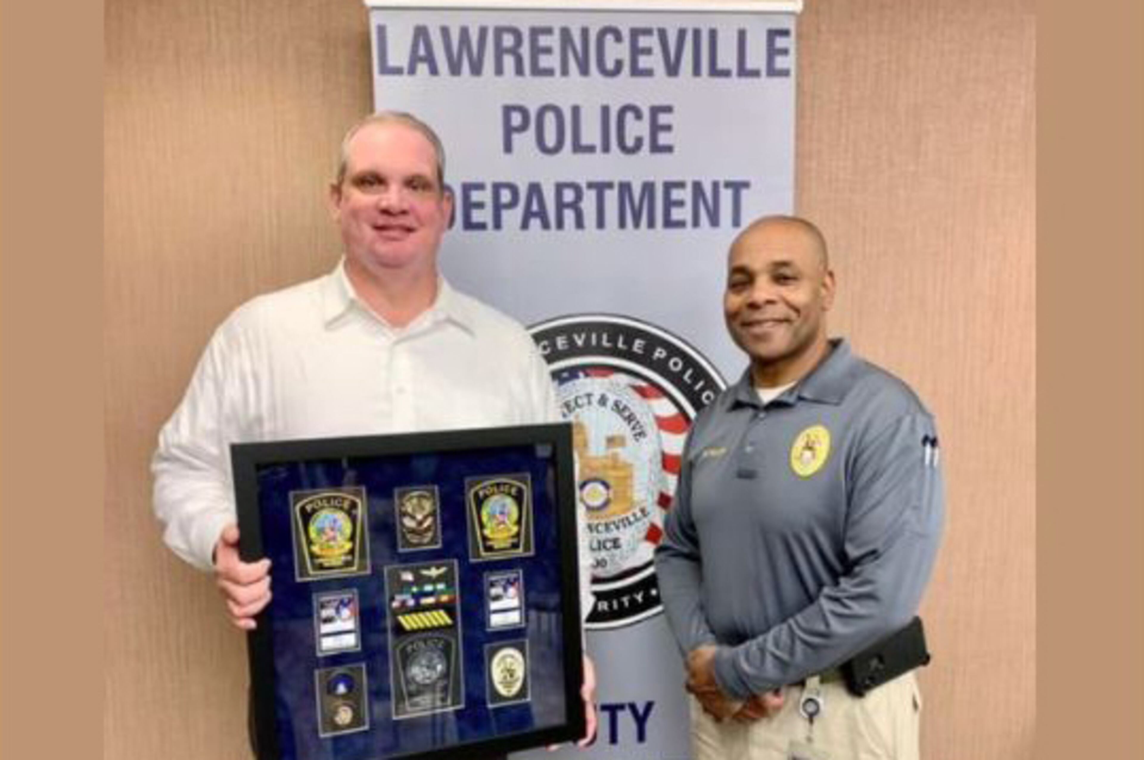 Capt. Ryan Morgan (L) with Lawrenceville Assistant Chief Myron Walker (R)