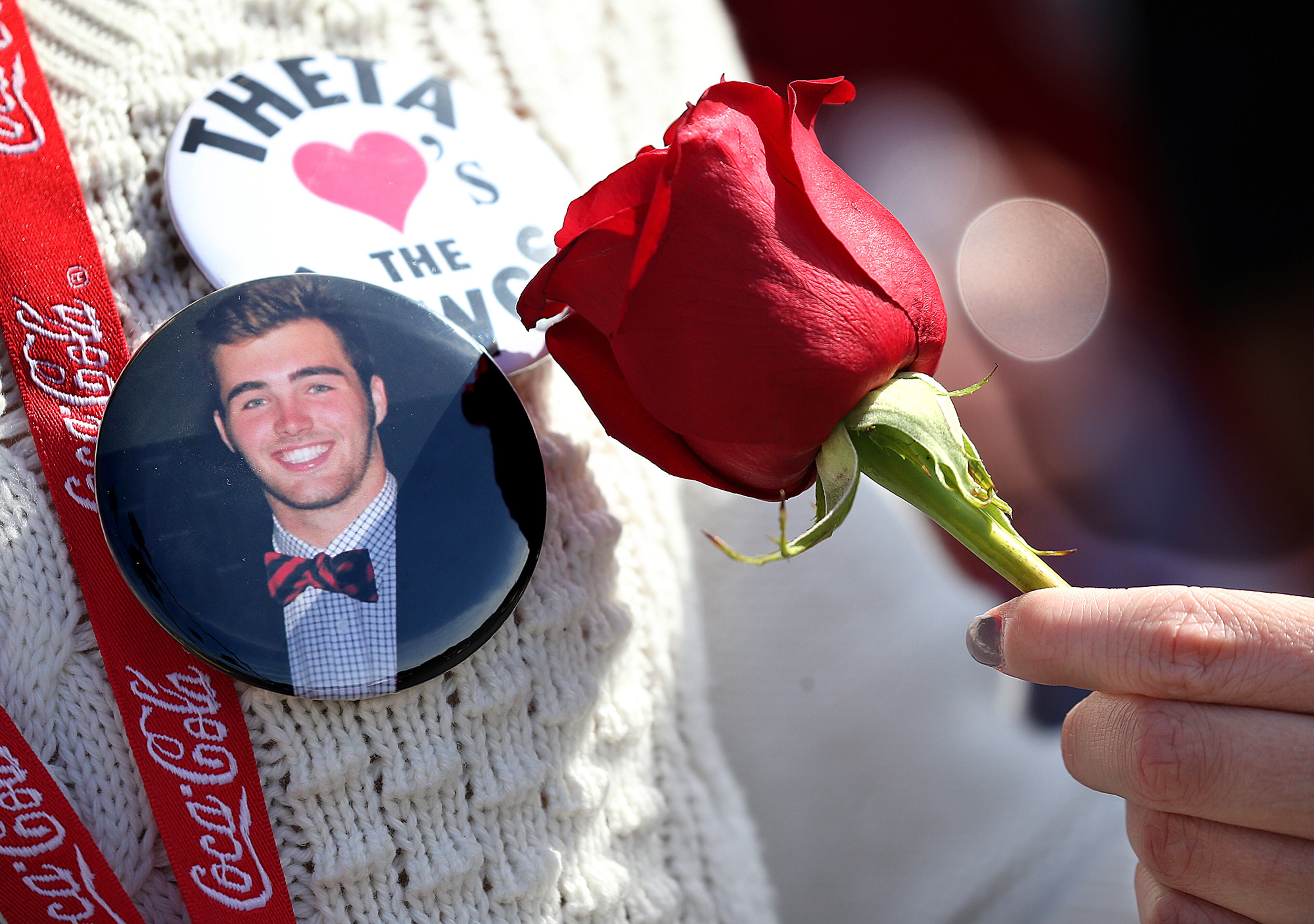 January 1, 2018 Pasadena: Jake Fromm supporter Alexandra Couturier, St. Simons Island, sports his button and holds her rose while cheering the team during arrival for the College Football Playoff Semifinal at the Rose Bowl Game on Monday, January 1, 2018, in Pasadena. Curtis Compton/ccompton@ajc.com